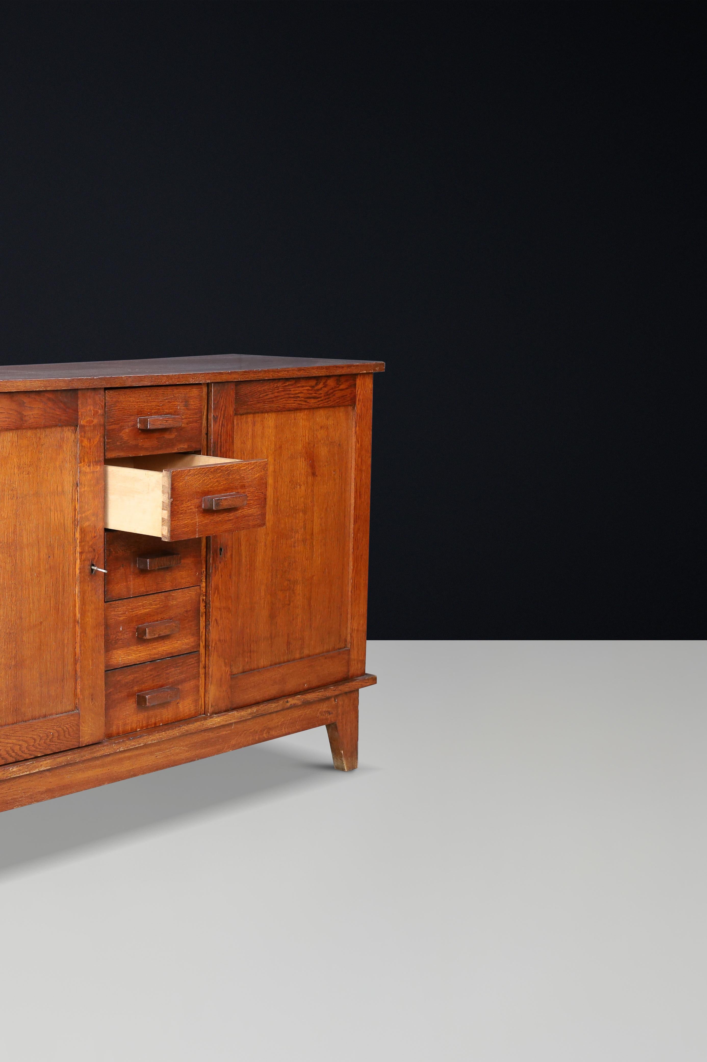 20th Century René Gabriel Patinated Oak Sideboard, France, 1940s For Sale