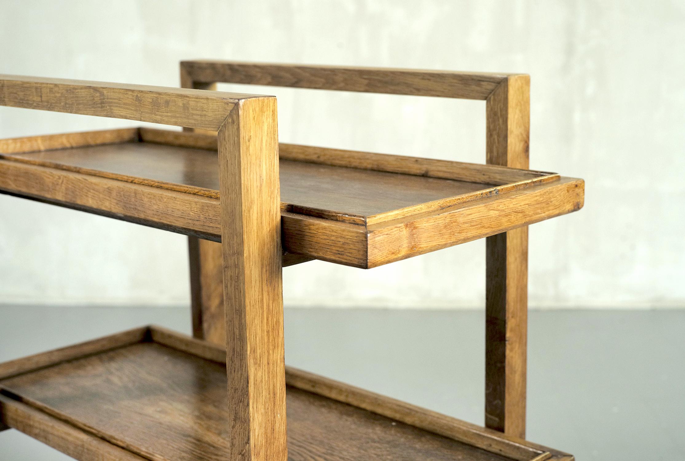Trolley with two removable trays RG 15 in blond oak by René Gabriel, France 1946. Designed in 1937, this trolley is a masterpiece of sobriety and rationalism. The two arches are connected by spacers forming the support of the two trays. Four large