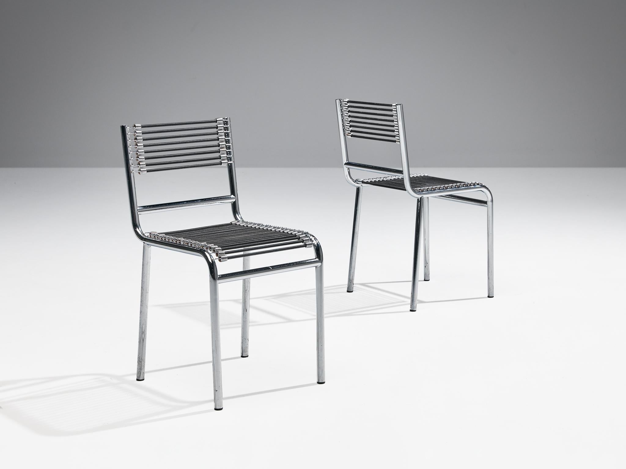 René Herbst, pair of 'Sandows' chairs, model '101', chrome-plated steel, elastic rope, France, design 1928, produced 1970s.

The 'Sandows' chair epitomizes the industrial advancements of the twenties, featuring a tubular steel construction