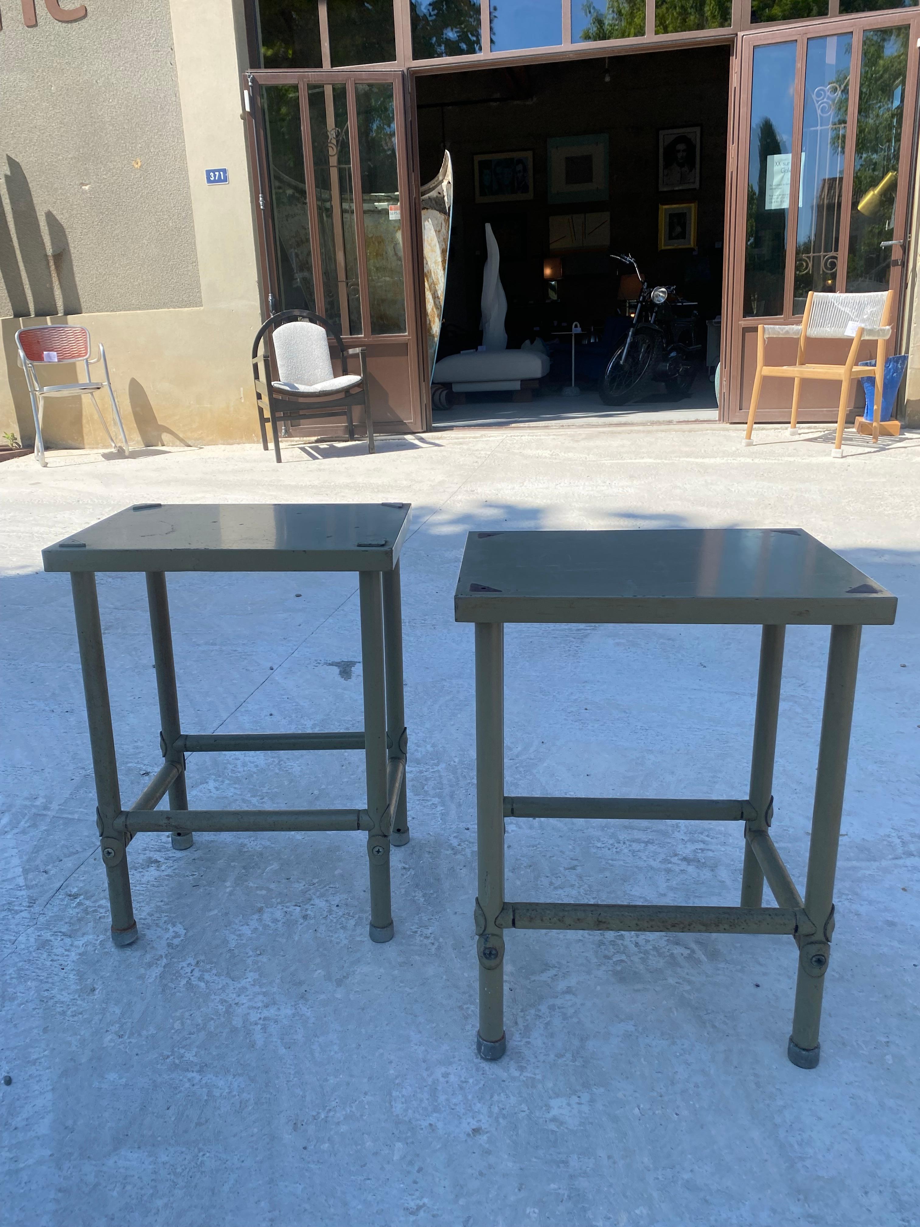 
René Herbst
Pair of side tables/ bedside tables 
Designed and produced for the Maison de la Chimie in Paris 
Gray lacquered metal
Good used condition 
60 h x 45 w x 33 d cms 
1943
990 euros per pair
