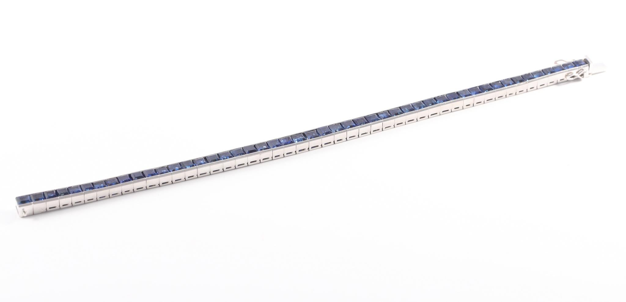 Natural sapphire platinum channel set René Kern line bracelet features 13.91 carats Carré cut sapphires. Signed Kern, Pt 950, and serial number. 