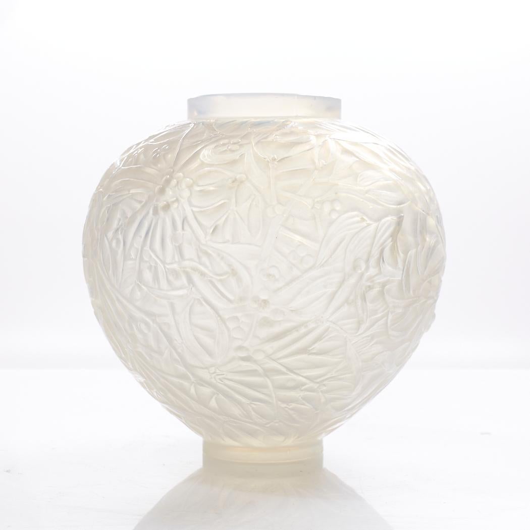 René Lalique 1920s Gui Frosted Glass Vase

This vase measures: 7 wide x 7 deep x 6.5 inches high

We take our photos in a controlled lighting studio to show as much detail as possible. We do not photoshop out blemishes. 

We keep you fully informed