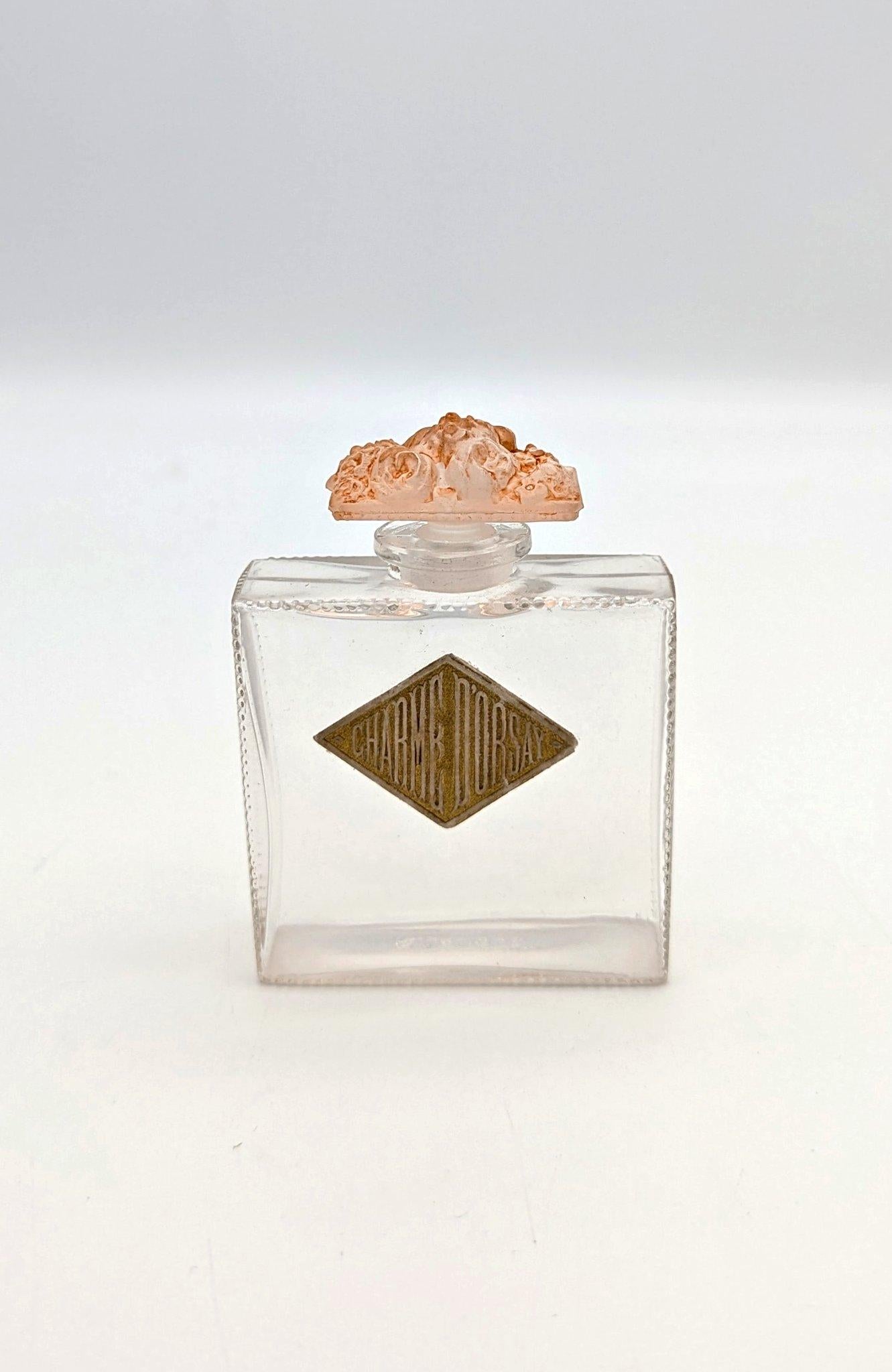 A glass perfume bottle Fleurs de France for D’Orsay, designed by René Lalique and made in his glassworks, likely those located in Combs-la-ville, which was before he opened a larger scale manufacture in Wingen-sur- Moder due to continuous success.