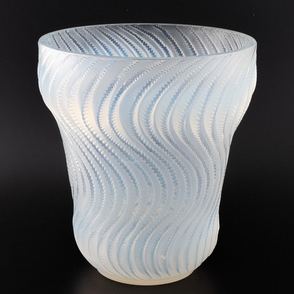 Heading : Opalescernt Rene Lalique Actinia Vase – Marcilhac 10-889
Date : Designed 1934
Origin : Wingen-sur-Moder. Alsace. France
Bowl Features : Parallel, undulating and sinusoidal high relief serriform bands. Press moulded and polished double ogee