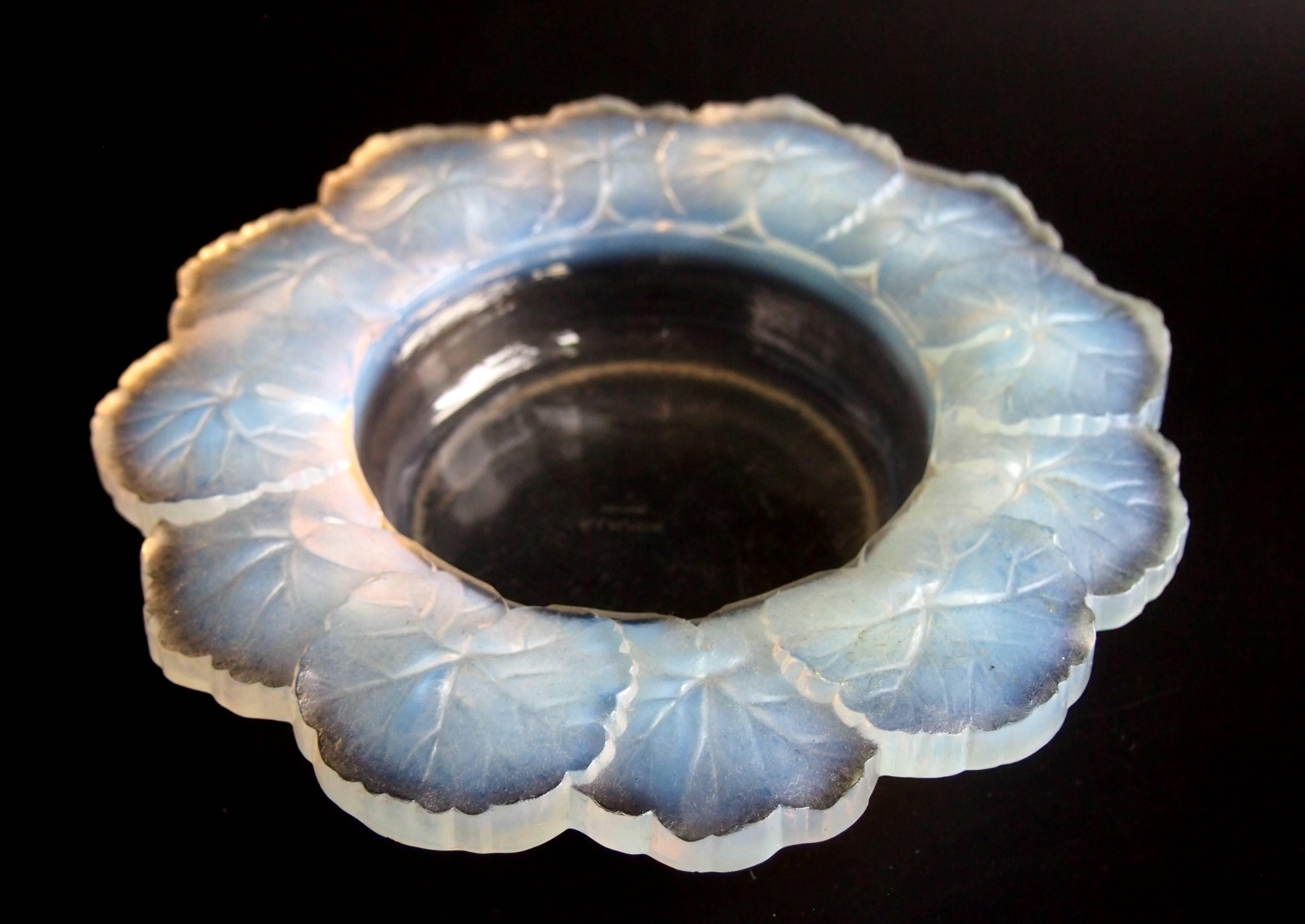 A super signed late Art Deco opal Rene Lalique Honfleur bowl, dating from 1945. The opalescence is particularly good in this example. This bowl is just at the transition between Rene Lalique and his son Marc -it is rarely seen opalescent.

Rene