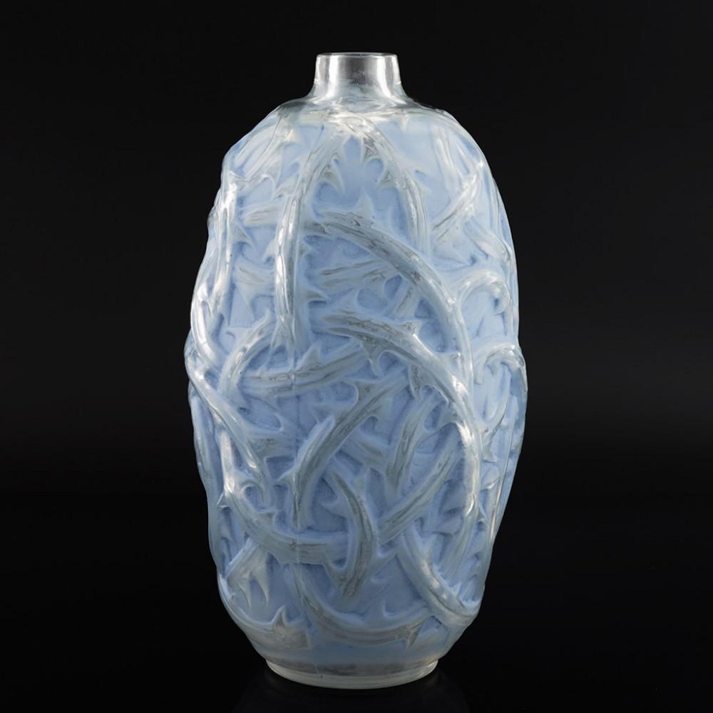 A Rene Lalique Ronces Vase designed in 1921. Powder blue stain with frosted and polished twisted thorny briars, made in Lalique's Wingen-sur-Moder studio in Alsace. Moulded signature on the base R Lalique and incised Lalique.

René Jules Lalique is