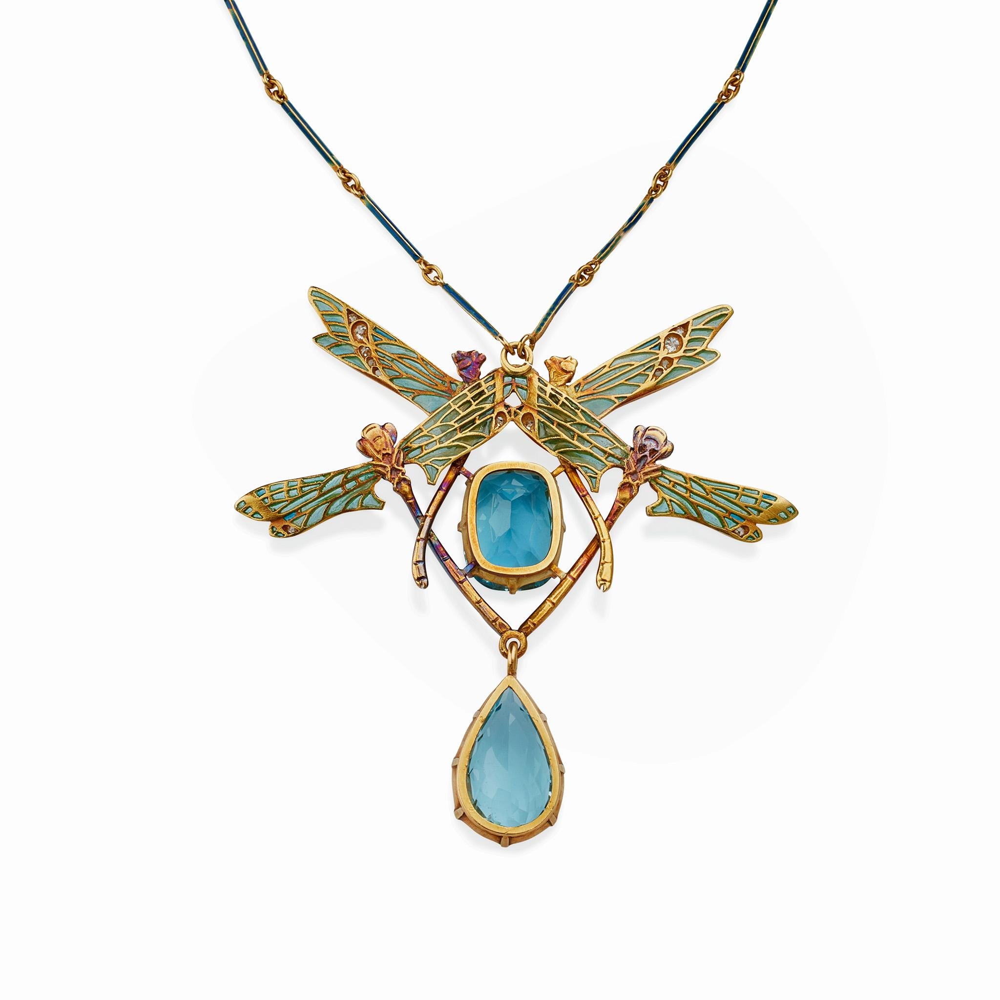 Created by René Lalique in 1903-1904, this four dragonfly pendant necklace is composed of plique-à-jour and basse taille enamel, aquamarine, diamonds and 18K gold. It is designed as two pairs of opposed dragonflies with plique-à-jour enamel wings