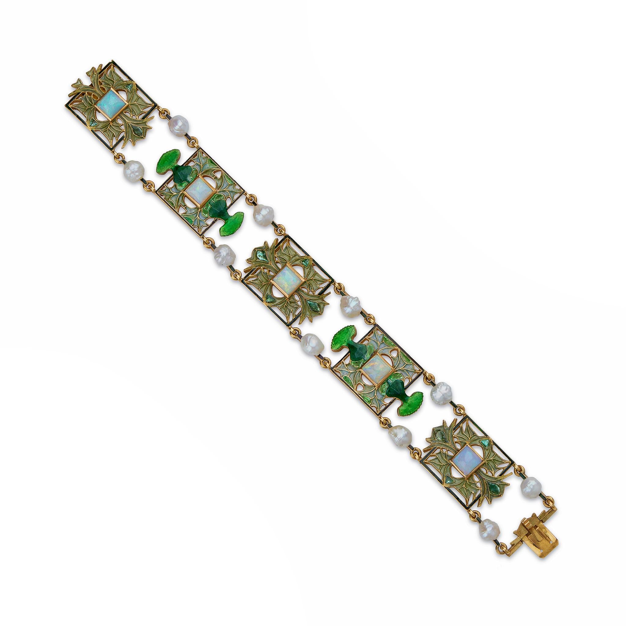 Created by René Lalique around 1901-1903, this plique-à-jour and basse-taille enamel, opal and freshwater pearl thistle of Lorraine bracelet is set in chased 18K gold. The bracelet is composed of rectangular links centering sugarloaf opals framed by