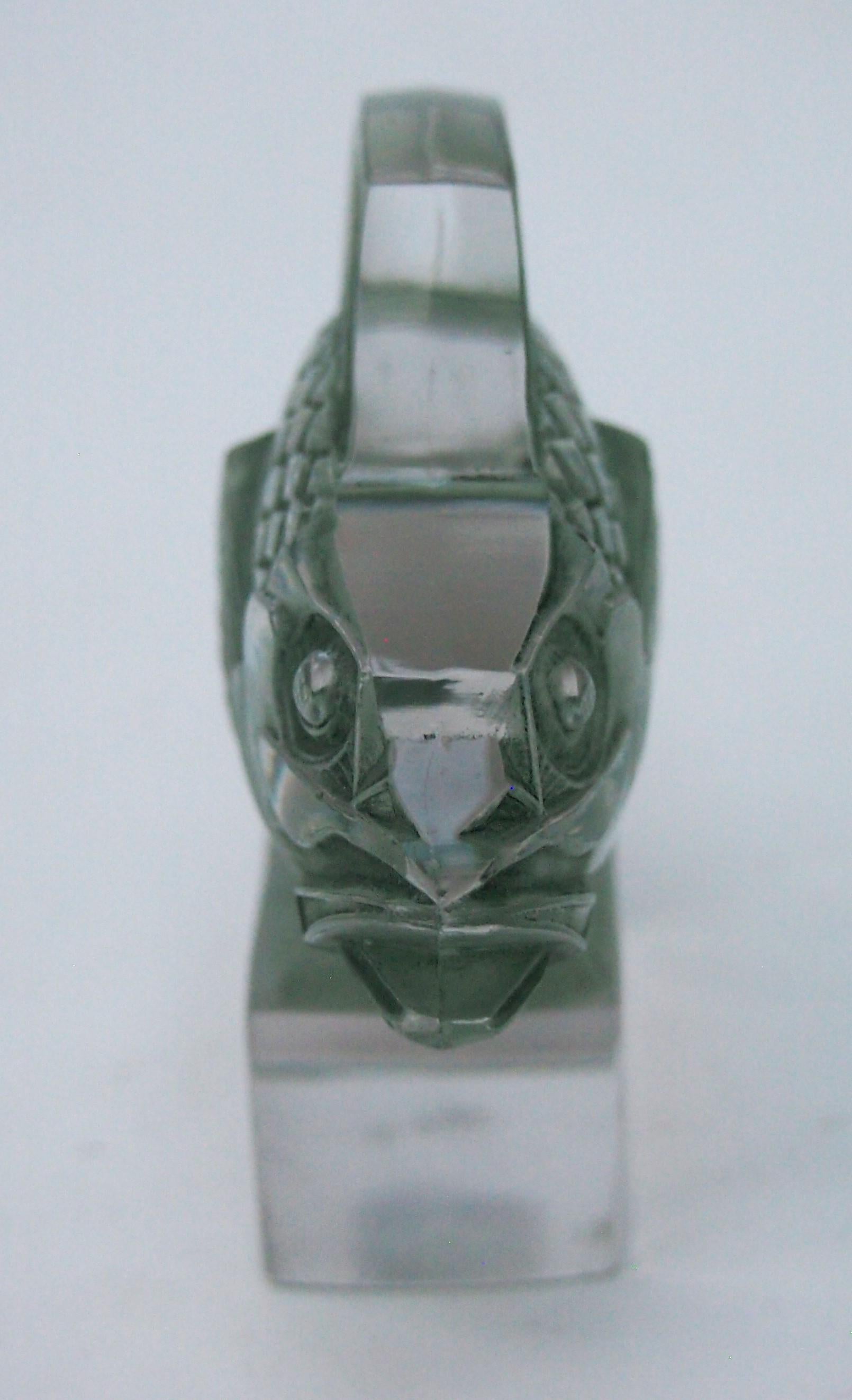 Classic and rare Rene Lalique 'Barbillon' fish  paperweight in original dark green staining. The paperweight shows a stylised Art Deco ugly beautiful fish -with prominent scales and small bug eyes standing on a small rectangular block base -this is