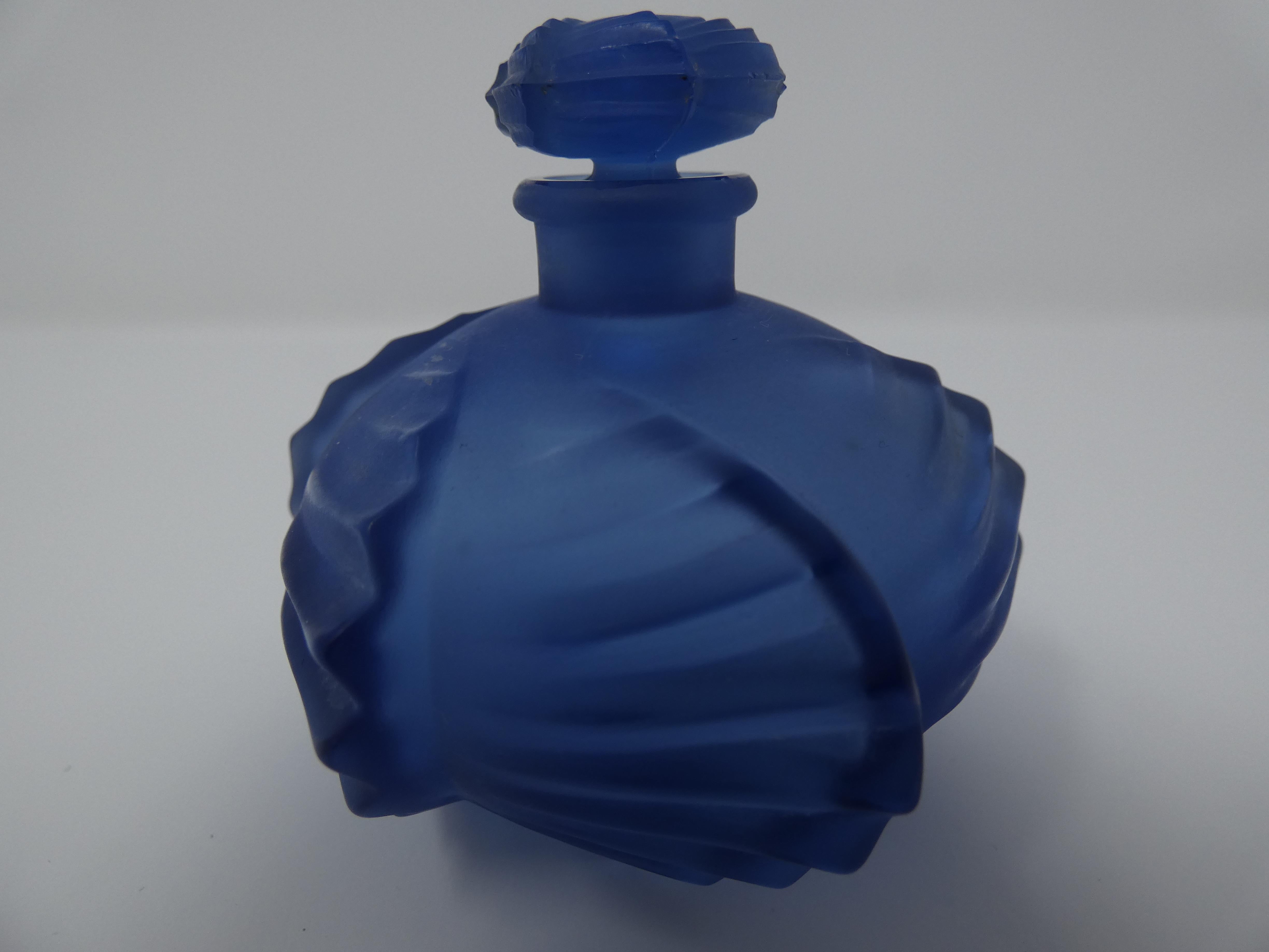 Rene Lalique blue glass 'Camille' perfume bottle. Moulded and engraved makers mark, 'R. Lalique France No516'. Book reference: Marcilhac 516.