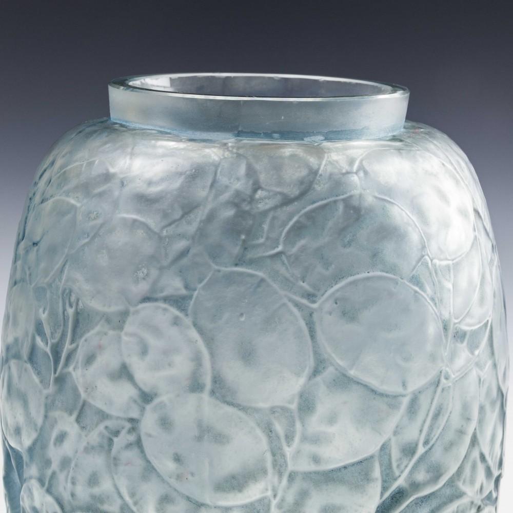 The superb René Lalique blue stained Monnaie Du Pape (Honesty) vase was designed as early as 1914. This fine example is in frosted clear glass with blue stain. Recorded as Marcilhac 897.

 