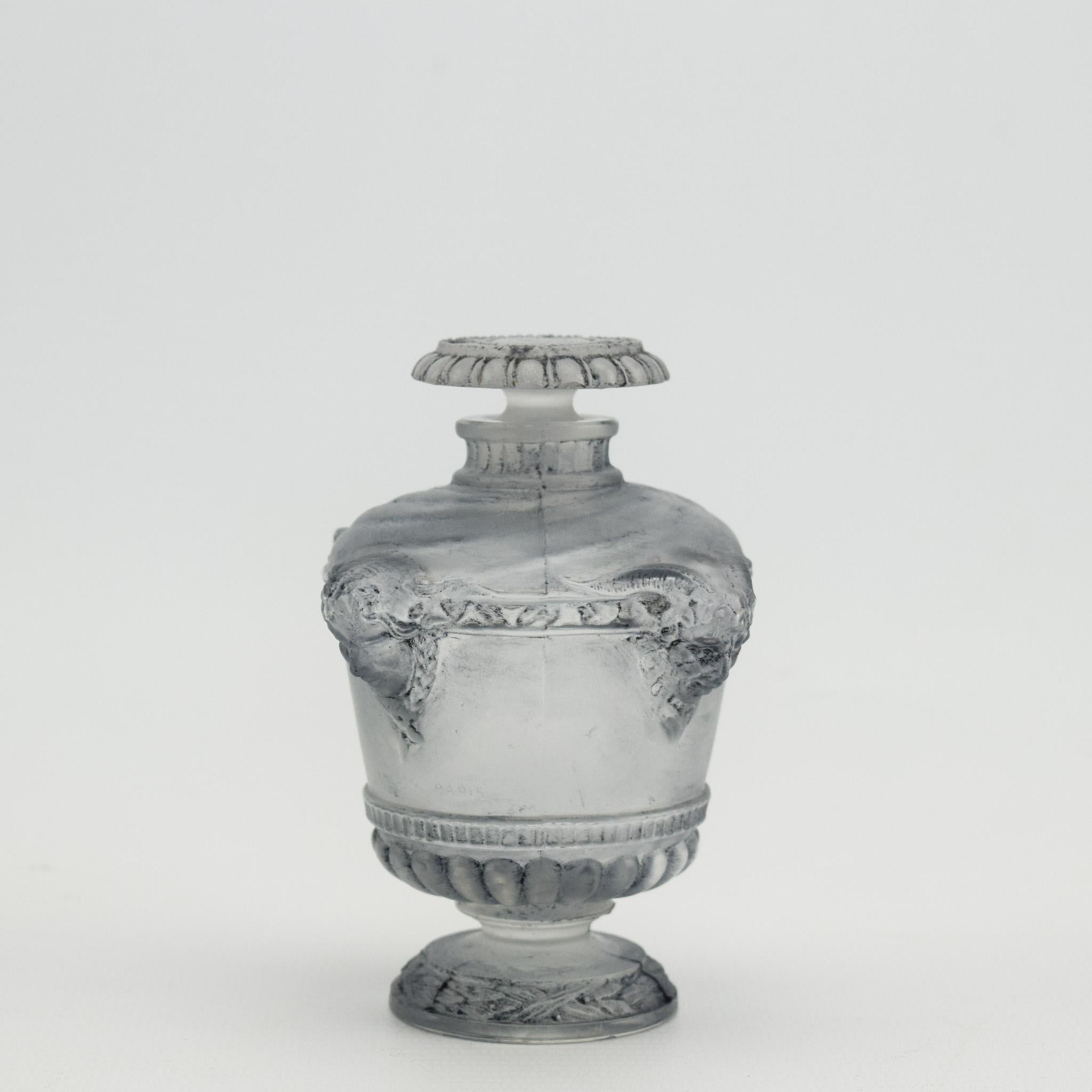 Rene Lalique Bouquet de faunes perfume bottle
Highlighted with grey patina.
Marcilhac page ref 940
Model - Guerlain -1 
introduced in 1925
Faintly moulded to the side of the bottle Guerlain Paris
The condition is very good with no damage or faults