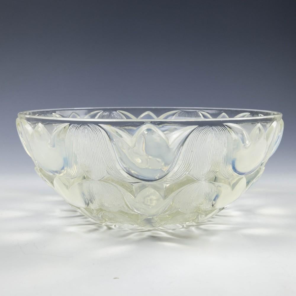 Rene Lalique Campanules bowl Marcilhac 10-380

Interlocking bellflowers alternating ribbed and opalescent

Designed 1932.

