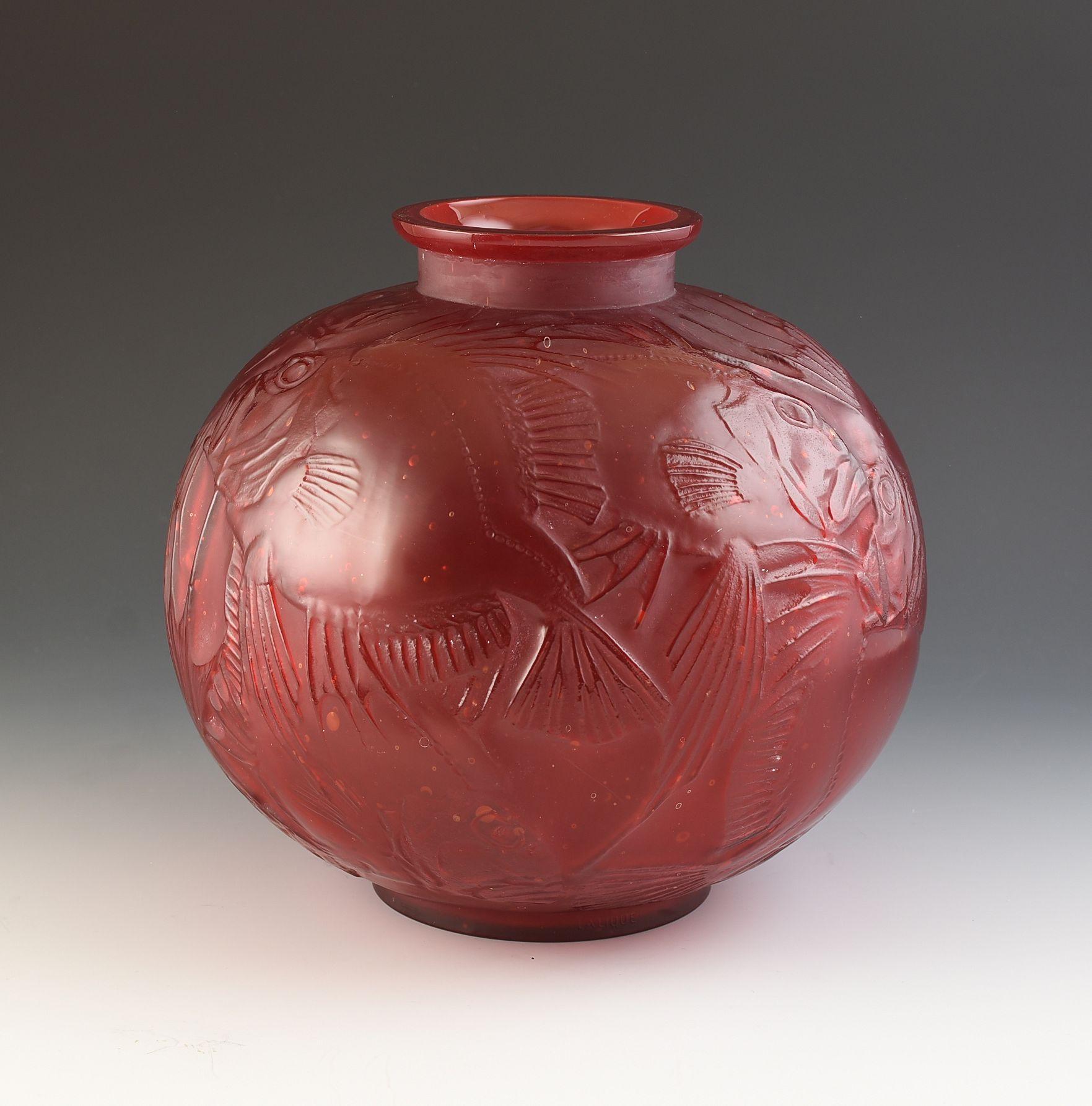 Rene Lalique 'Cased' Red Poissons vase C.1921 and model number is 925.
An superb example showing perfect colour and definition. The vase HAS NOT been subject to any kind of damage or restoration. It is totally original. 
Overall height is 24cm and
