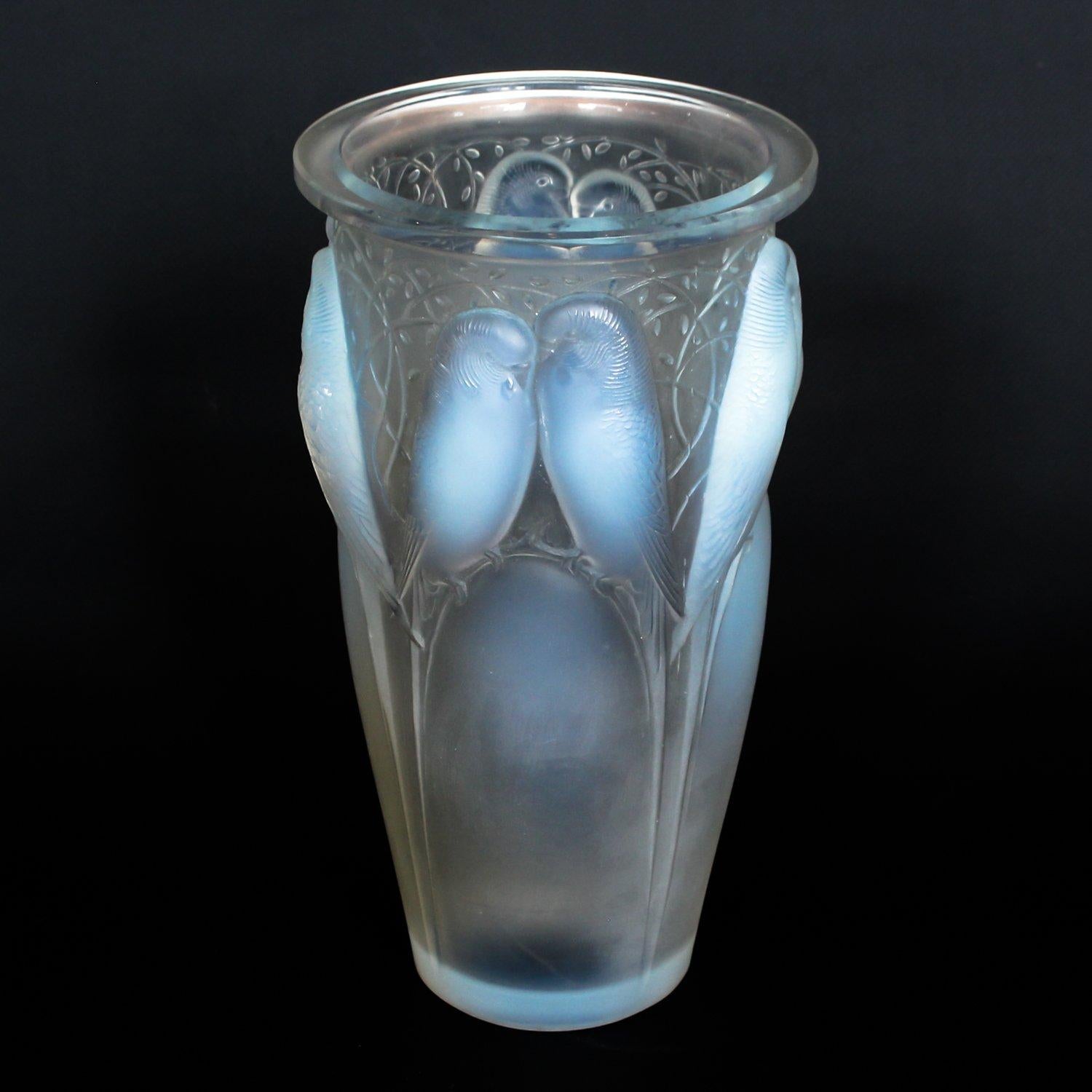 Ceylan, a frosted and opalescent glass vase. Hand etched R Lalique France to underside. 

Marcilhac, R Lalique Catalogue Raisonné de L’Œuvre de Verre p.418, model number 905.

Artist: René Lalique, (1860-1945)

Dimensions: H 25cm, D 12.5, W