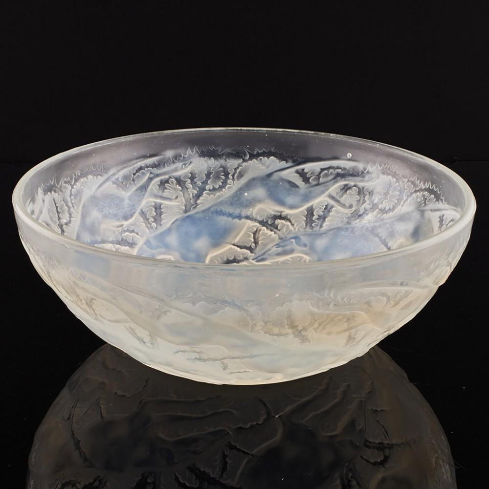 Heading : Rene Lalique Opalescent Chiens Bowl Designed 1921 Marcilhac 3214
Date : Designed and made in 1921
Origin : Wingen-sur-Moder, France
Bowl Features : Light opalescence withing the hounds
Marks : Rare early Lalique VDA mark in the centre of