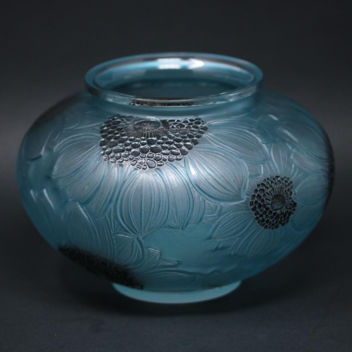 René Lalique clear and frosted glass 'Dahlia' vase. This pattern features overlapping Dahlia flowers, molded around the outside. Black enameled stamens and green/blue stained leaves. Moulded makers mark, 'R LALIQUE'. Book reference: Marcilhac 938.