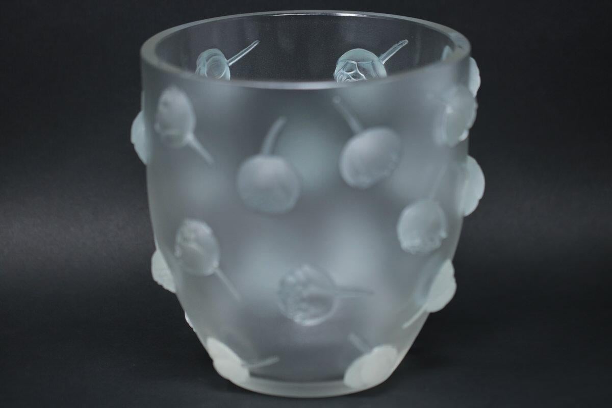 René Lalique clear and frosted glass 'Pivoines' vase. This pattern features cut peony flowers, in deep relief, around the sides. Stencilled makers mark, 'R LALIQUE FRANCE'. Book reference: Marcilhac 10-908.