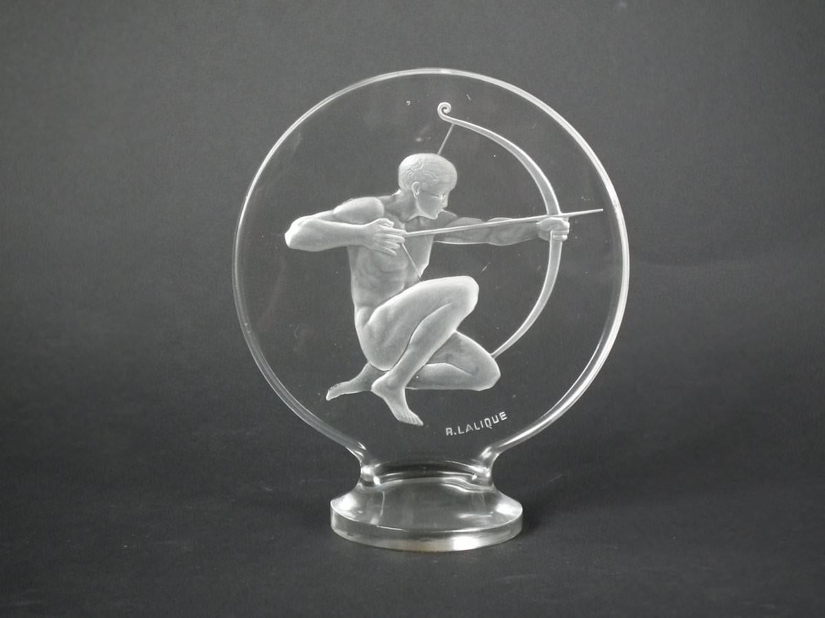 René Lalique clear glass 'Archer' Mascot. Moulded makers mark, 'R. Lalique '. Book reference: Marcilhac 1126.