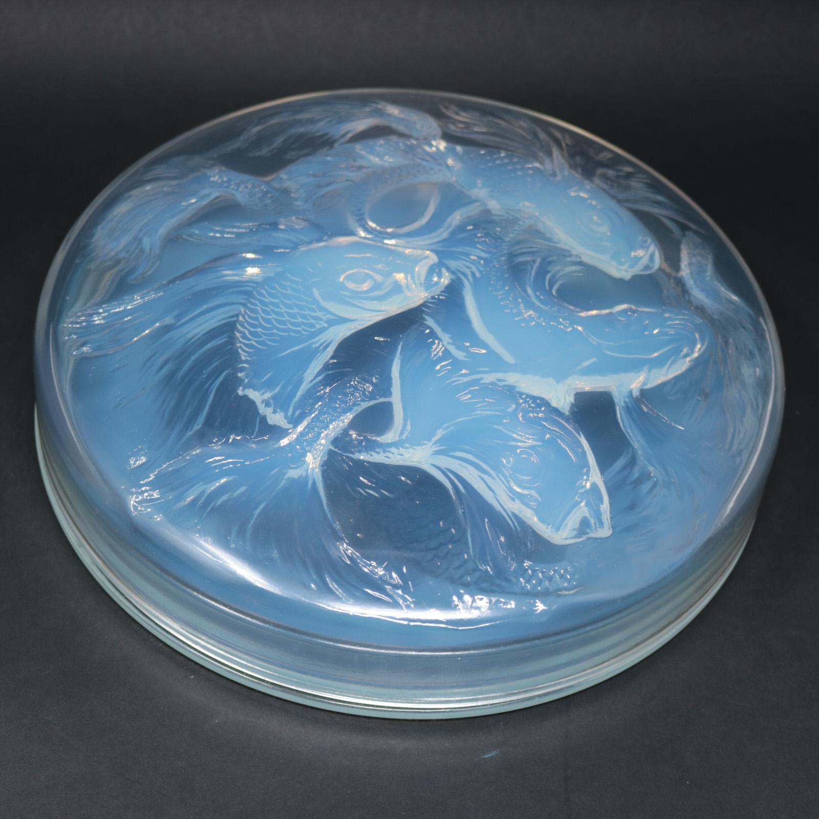 René Lalique clear and opalescent glass 'Cyprins' box. This pattern features fish - Cyprins translates to minnow. Moulded makers mark, 'R. LALIQUE ' on the lid. Engraved, 'France No.42' to side of lid. Book reference: Marcilhac 42.