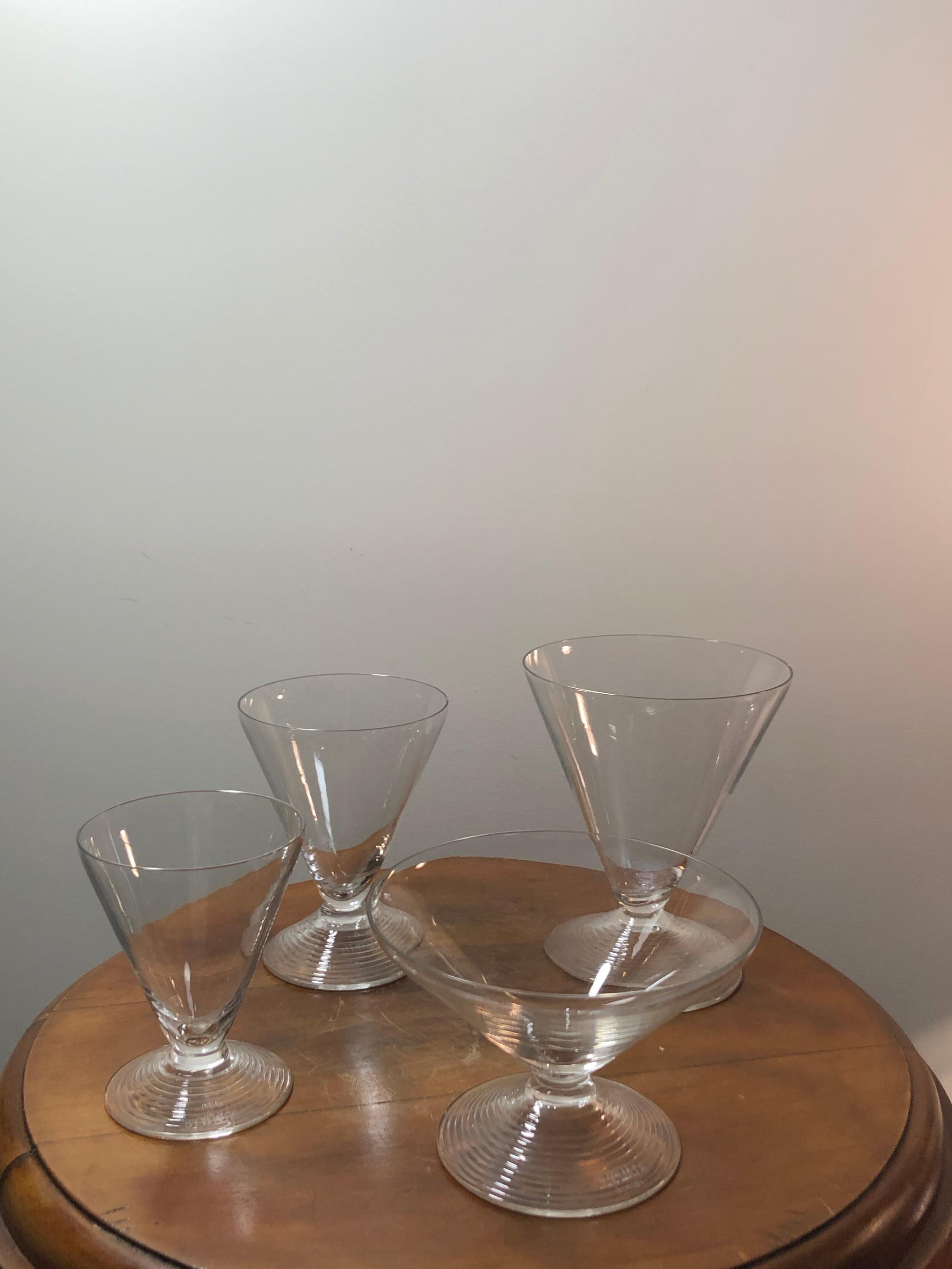 Set of 43 pieces : 40 drinking glasses, 2 pitchers and 1 decanter made by René Lalique in 1937. Model is named 