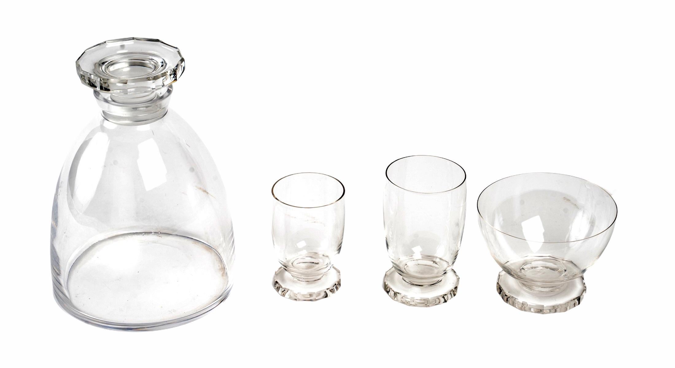Set of 25 pieces: 24 drinking glasses, 1 decanter made by René Lalique in 1938. Model is named 