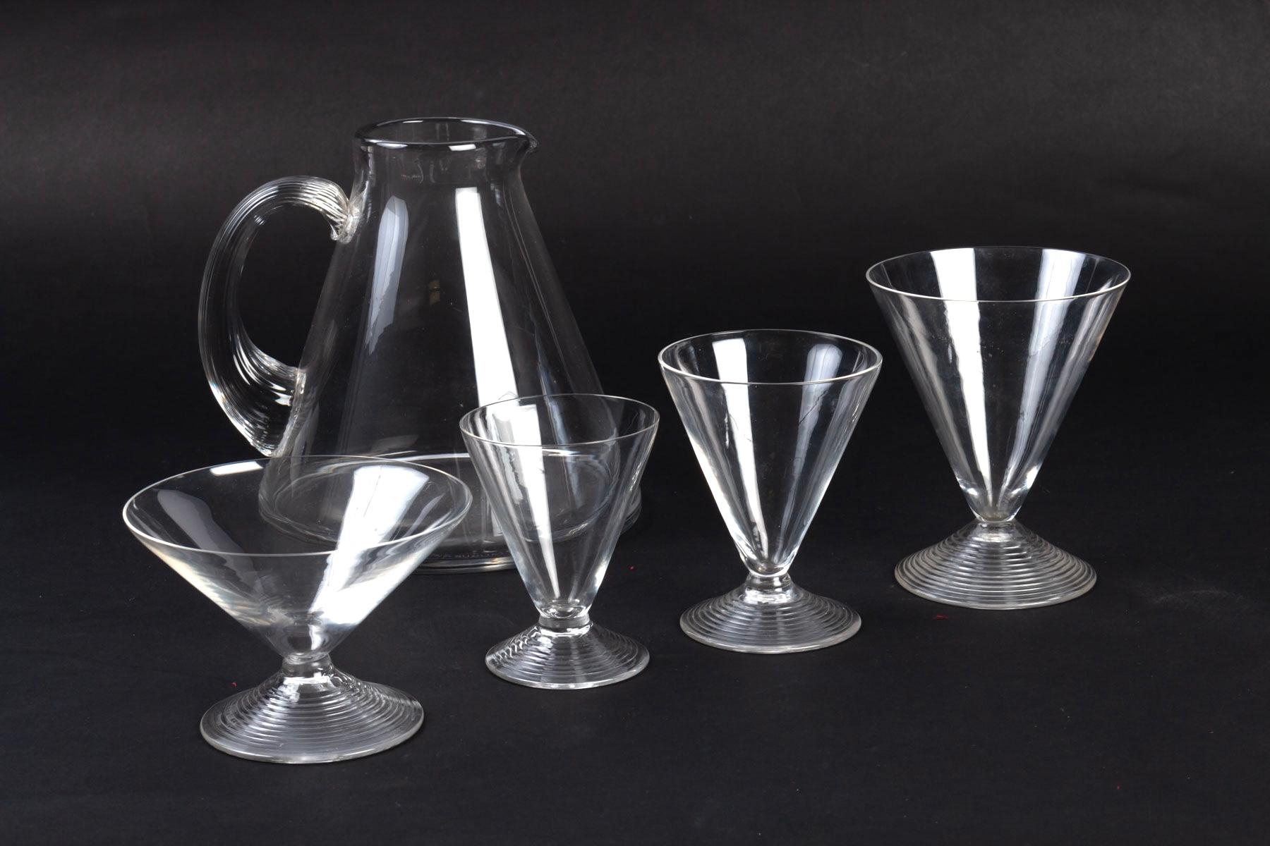 Set of 49 pieces: 48 drinking glasses, 1 pitcher made by René Lalique in 1937. Model is named 