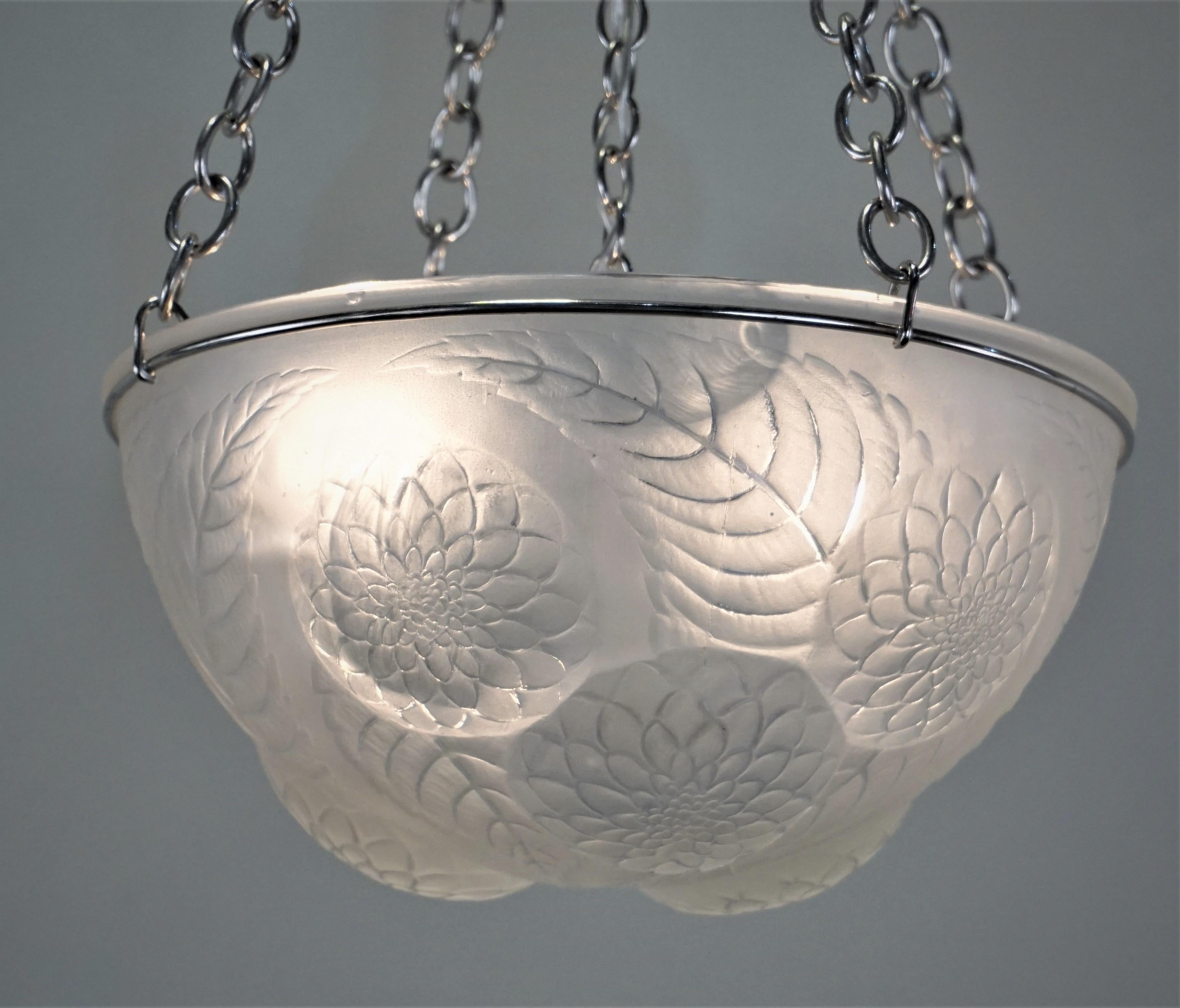 This French art deco glass chandelier was designed by Rene Lalique in late 1920s.
US wiring, 4 lights 60 Watt max each.
  