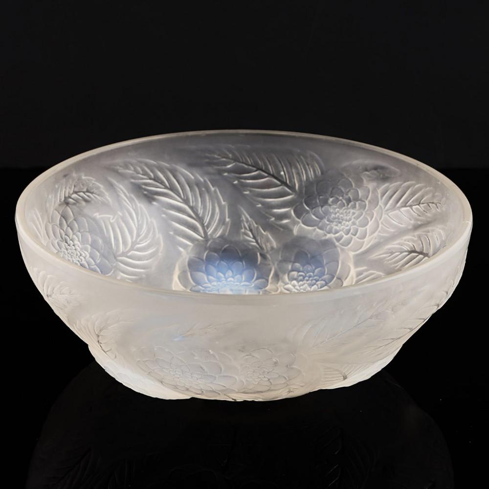 Heading : Rene Lalique Dahlias No. 1 bowl 
Date : Designed 1921
Origin : Wingen-sur-Moder, France
Bowl Features : Frosted glass with dahlia decoration, the central flowers have opalescence. 
Marks : Moulded R Lalique France mark
Type : Lalique