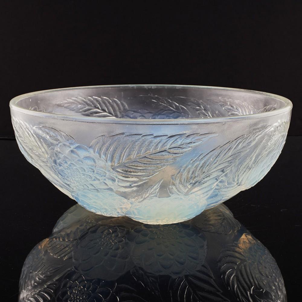 Heading : Rene Lalique Dahlias No. 1 bowl  
Date : Designed 1921 and made between 1921 and 1923 -
Origin : Wingen-sur-Moder, France
Bowl Features : Frosted glass with dahlia decoration, the central flowers have opalescence. 
Marks : Moulded rare VDA