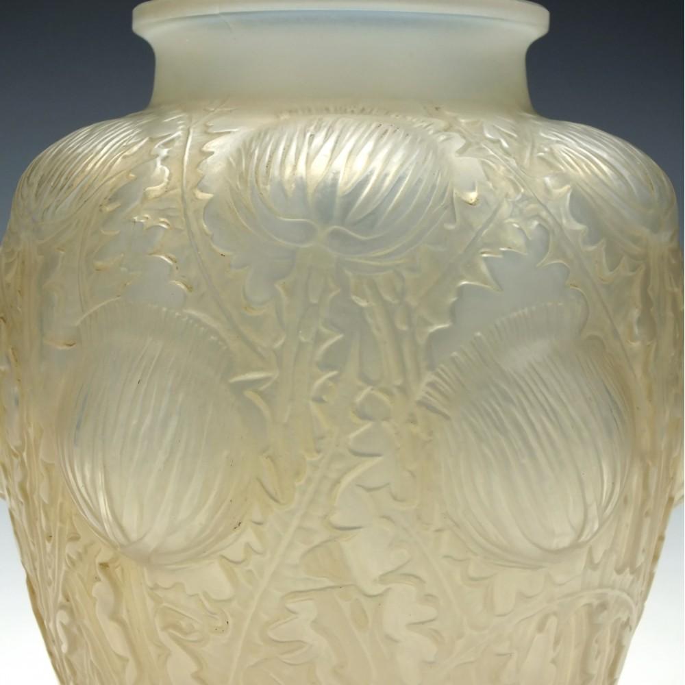 René Lalique Domremy vase Marcilhac 979
Tapering body with moulded thistles
Signed R Lalique France to the base
Designed 1926.