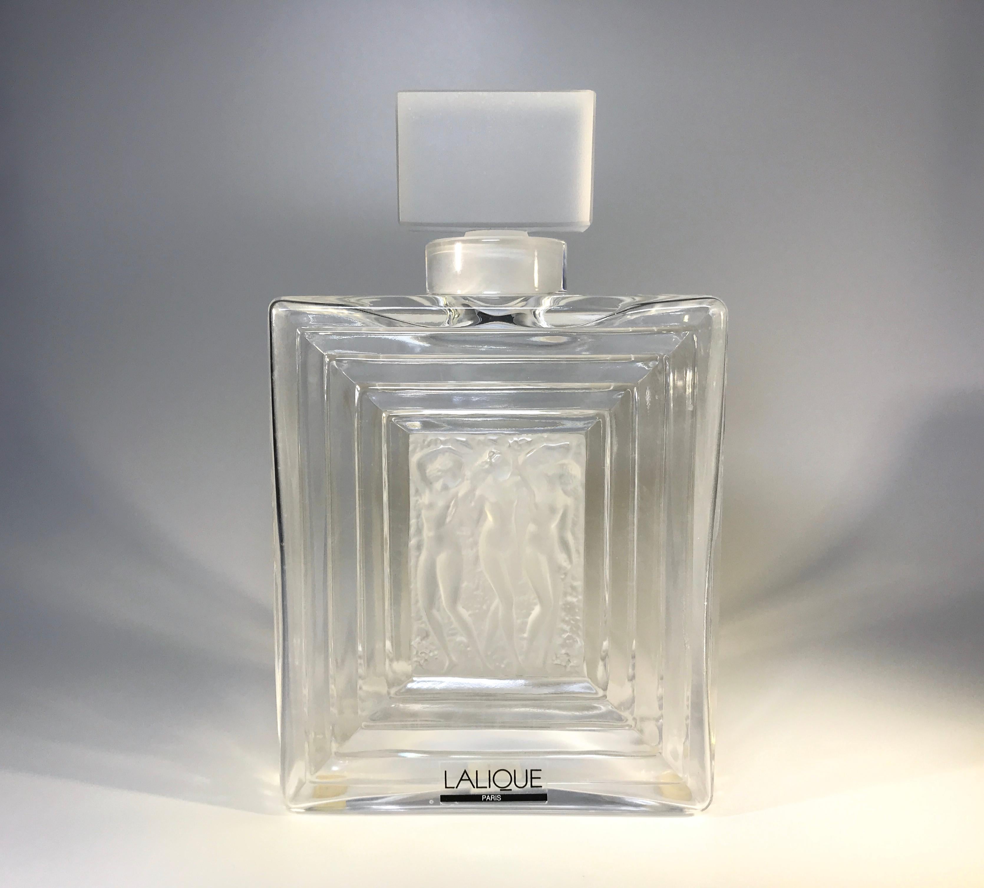 Inspired by the American dancer Isadora Duncan, Rene Lalique designed a series of Duncan perfume bottles that vary in size according to the number of dancers.
This piece is known as the Duncan No.2 flacon and has three dancing nudes in a frosted