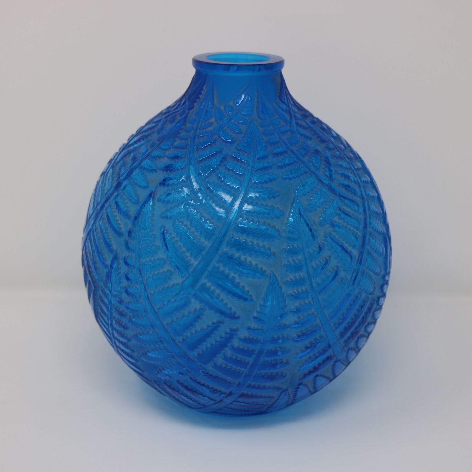 Rene Lalique Electric Blue Glass Espalion Vase. This pattern features a mosaic of fern fronds. Molded makers mark, 'R LALIQUE' and engraved, 'France'. Book reference: 'R. LALIQUE Catalogue Raisonné De L'Oeuvre De Verre', by Felix Marcilhac. Les