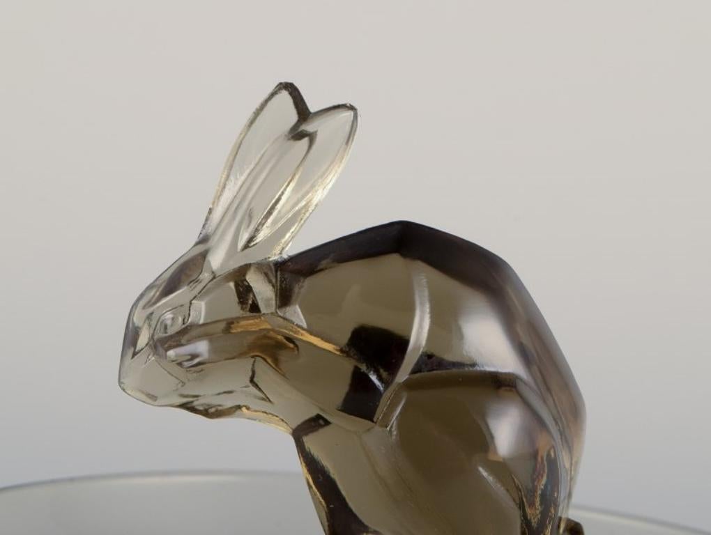 René Lalique, France. Early Art Deco pin dish with a rabbit in smoked art glass. 1
