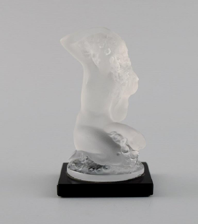 René Lalique, France. Nude woman in frosted art glass. 
Mid-20th century.
Measures: 8.5 x 8 cm.
In excellent condition.
Signed.