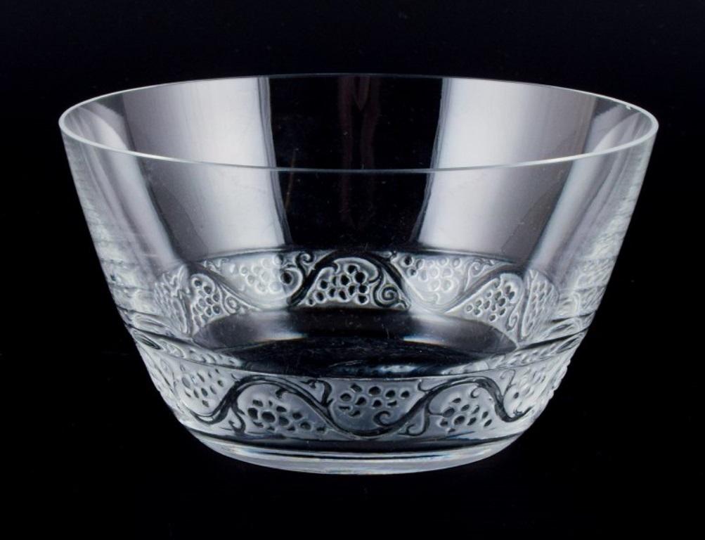 René Lalique, France. 
Two Phalsbourg fingerbowls in clear art glass with vines and grapes in relief.
Mid-20th century.
Perfect condition.
Signed.
Dimensions: D 12.0 x H 6.5 cm.