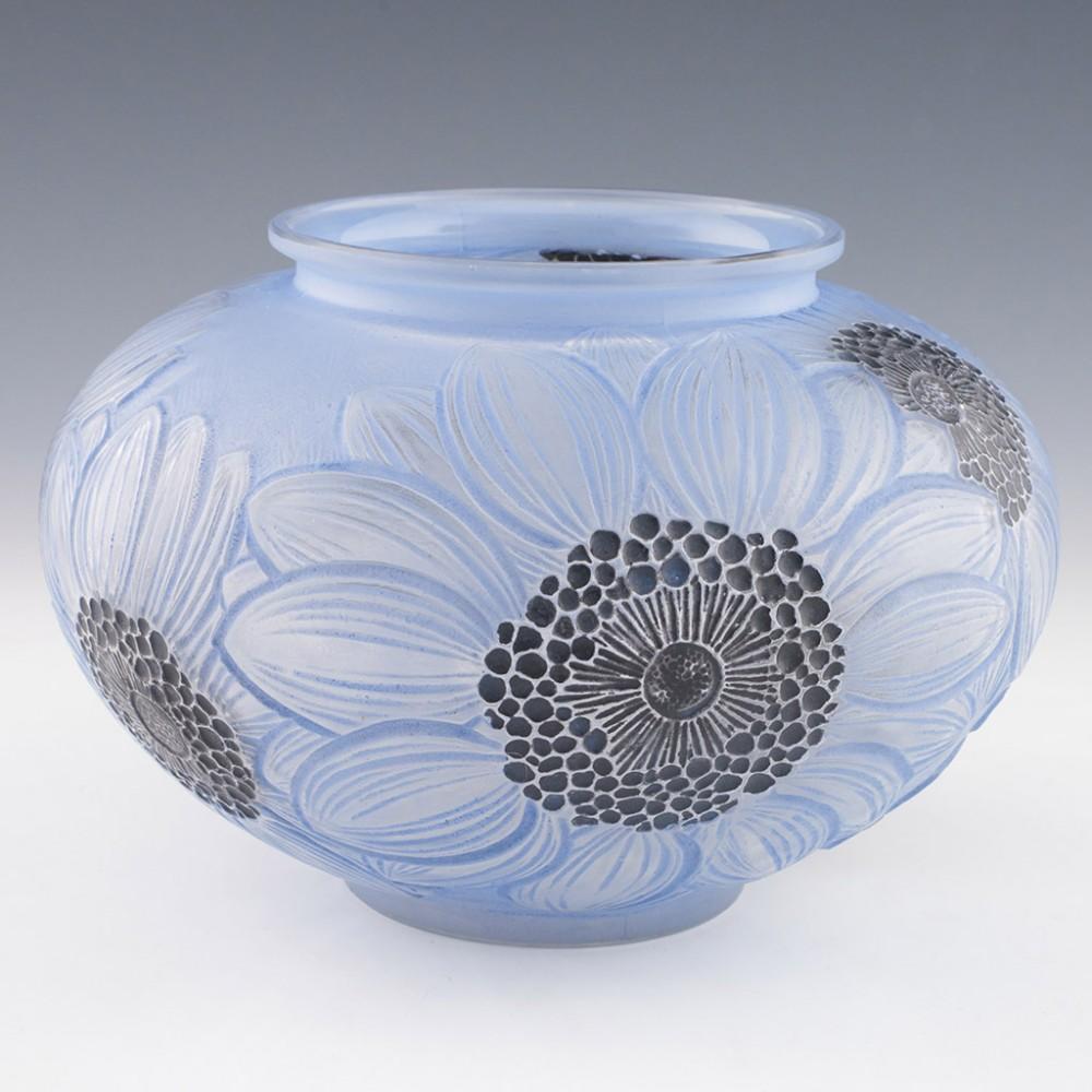 Heading : Rene Lalique Dahlias vase
Date : Designed 1923
Origin : Wingen-sur-Moder, France
Bowl Features : Moulded dahlia decoration, blue staining a with grpahite stamen and stigma. 
Marks : Stencilled R Lalique France - No. 938 to base
Type :