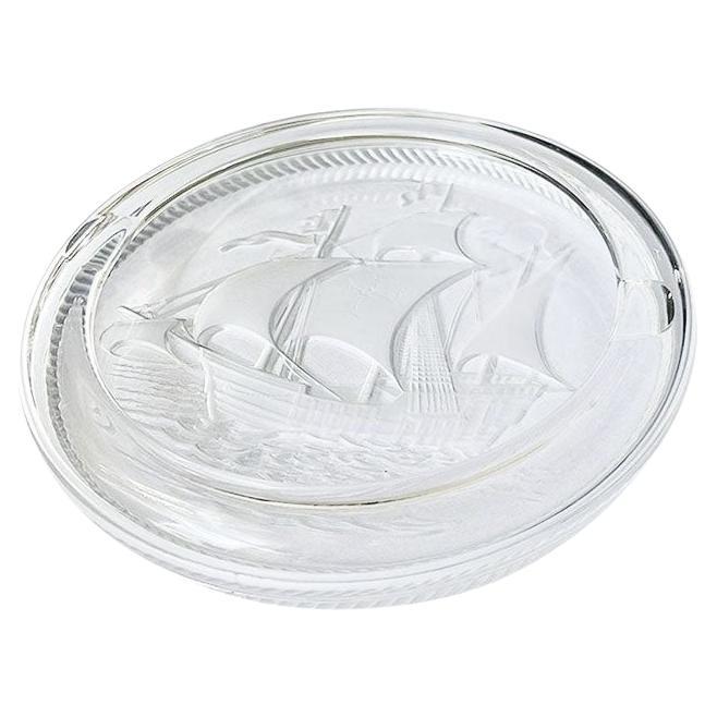 An original René Lalique large round crystal ashtray with an etched Galleon Schooner Ship motif. This piece is signed by the artist and in remarkable condition. It could be used as an ashtray, or even as a vide poche trinket dish or decorative bowl