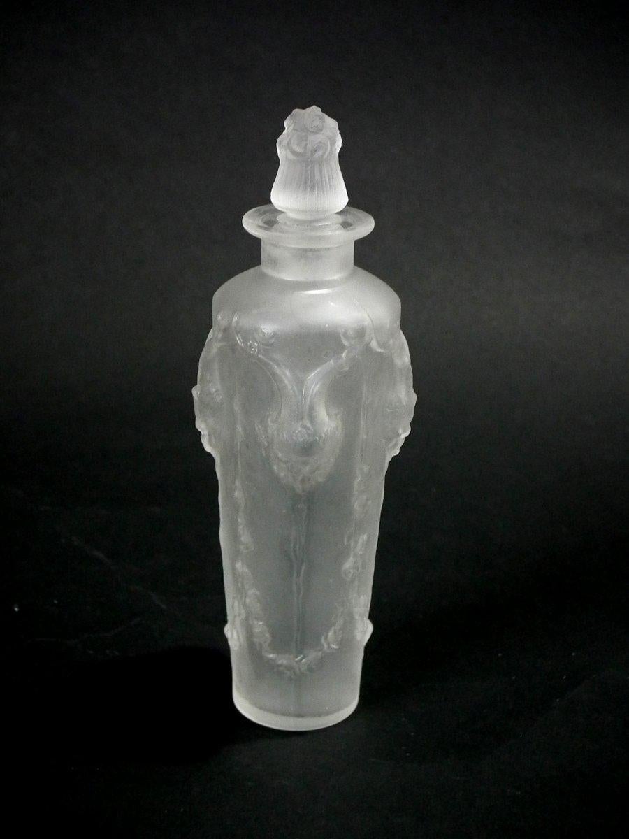 René Lalique frosted glass 'Pan' perfume bottle. Molded and engraved makers mark, 'R. LALIQUE France no.504'. Book reference: Marcilhac 504.