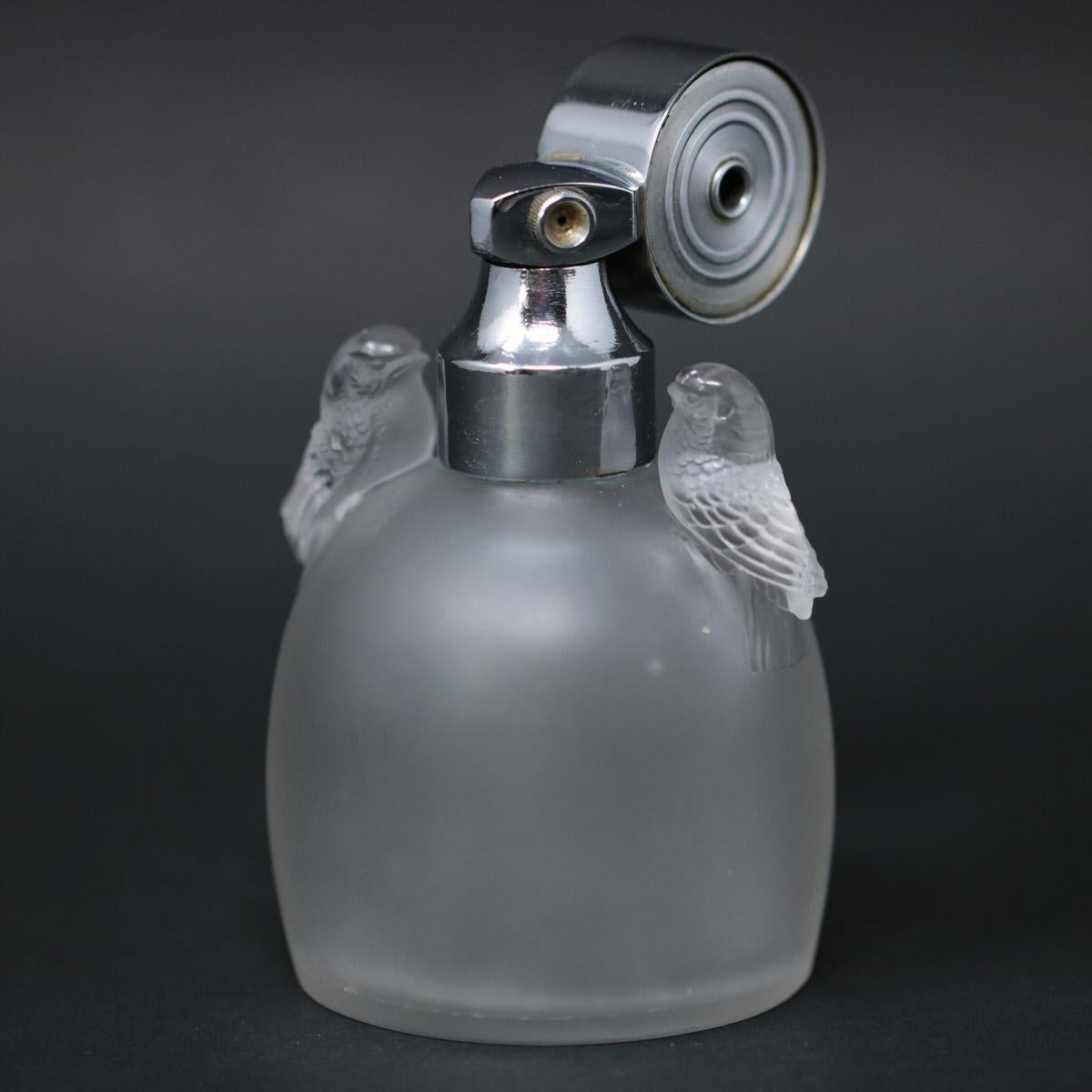 Rene Lalique frosted glass 'Marcel Frank Perruches' perfume bottle with atomiser. This pattern features two birds, sitting either side of the bottle neck. Wheel cut makers mark, 'R LALIQUE FRANCE', around base. Book reference: Marcilhac MARCEL FRANK