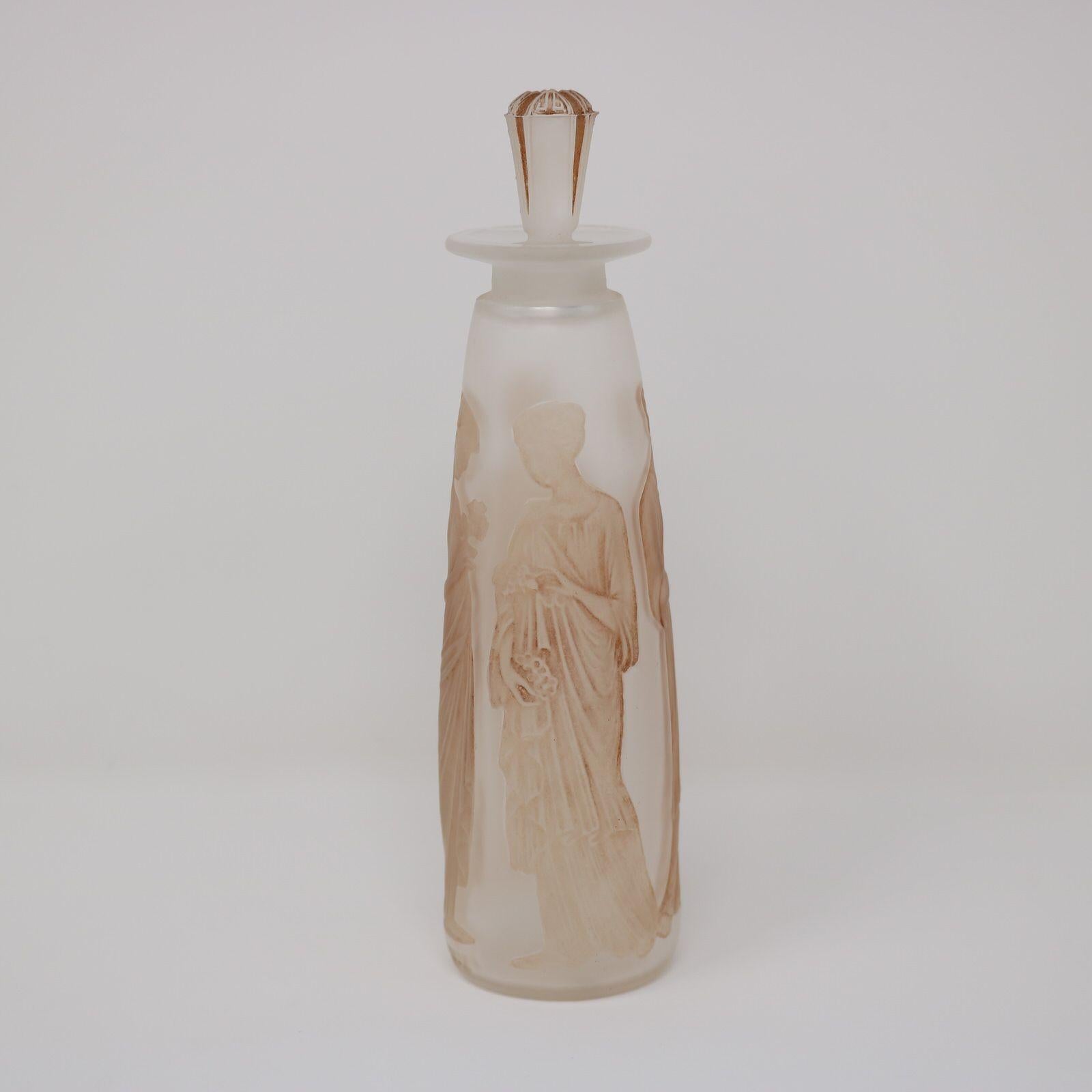 Rene Lalique clear & frosted, sepia stained glass perfume bottle. 'Ambre Antique' design. This design features robed maidens, holding flower bouquets. Moulded makers mark, 'R LALIQUE'. Book reference: 'R. LALIQUE Catalogue Raisonne De L'Oeuvre De