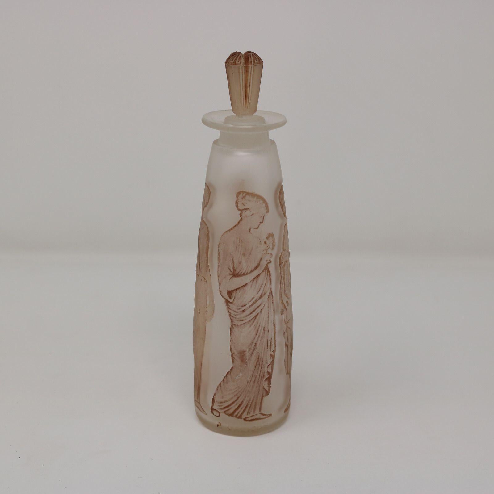 Rene Lalique clear & frosted, sepia stained glass perfume bottle, complete with original box. 'Ambre Antique' design. This design features robed maidens, holding flower bouquets. Moulded makers mark, 'R LALIQUE'. Book reference: 'R. LALIQUE