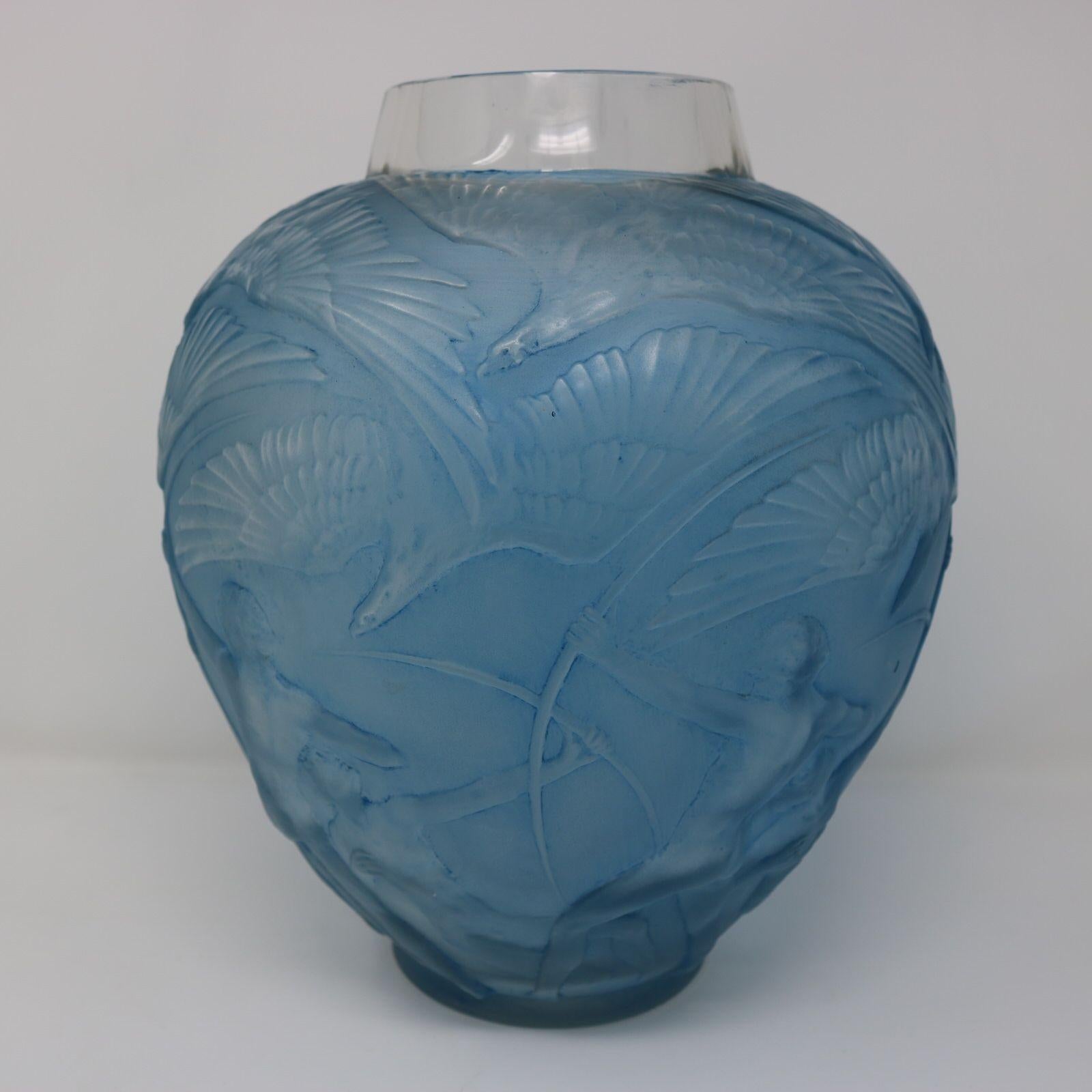 Rene Lalique Clear & Frosted Glass 'Archers' Vase, with blue staining to the details. This pattern features archers poised to shoot arrows around the bottom half. Eagles in flight around the upper half. Wheel cut makers mark, 'R. LALIQUE' and
