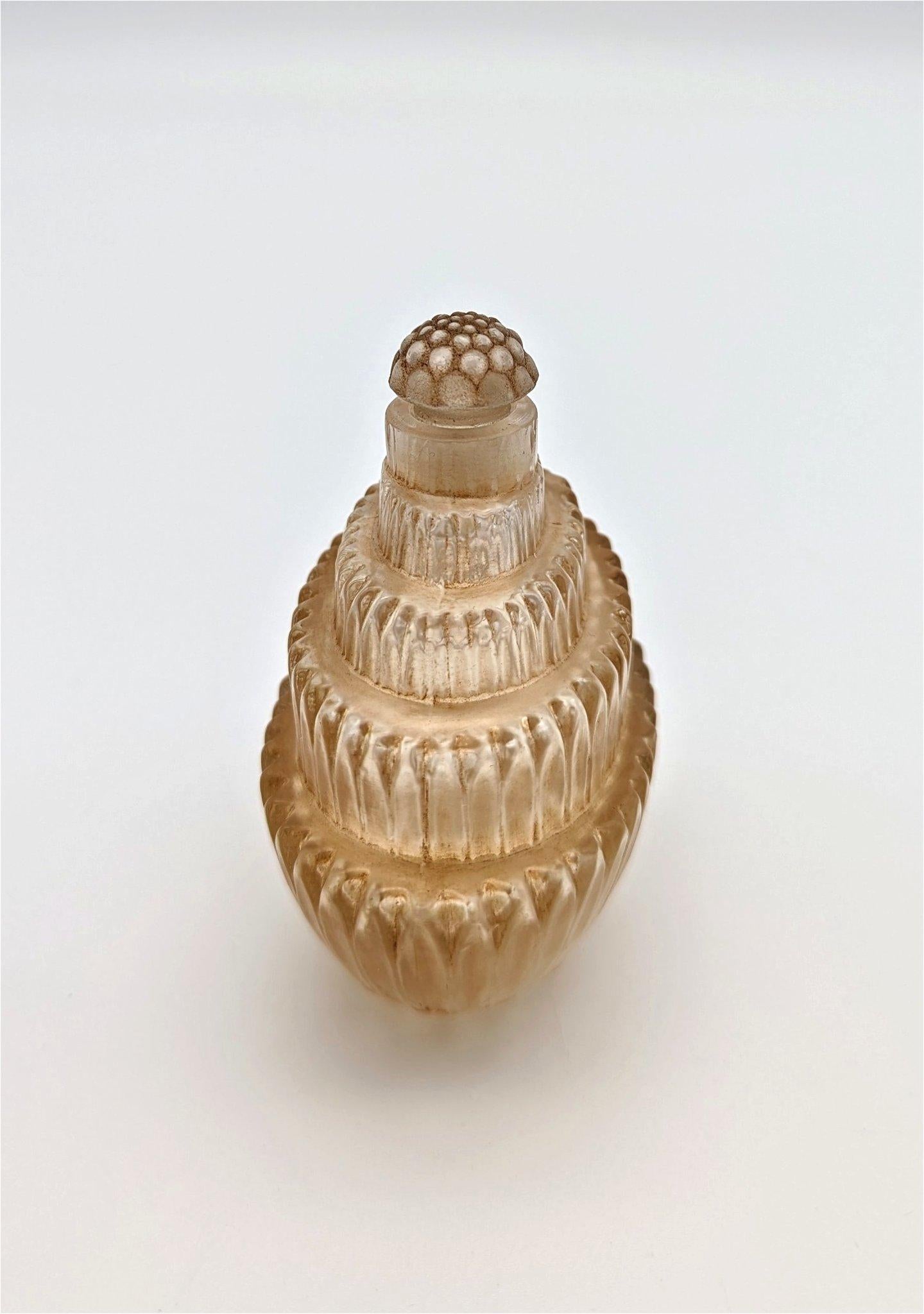 A good and early art deco perfume bottle designed by René Lalique in 1926 for the Maison Lalique titled 
