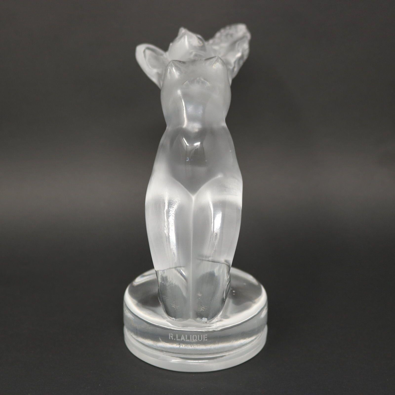 Rene Lalique clear and frosted glass 'Chrysis' car mascot (radiator cap). Features a naked female figure, kneeling, with her head thrown back. In ancient Greece, Chrysis was the priestess of Hera at the ancient Greek sanctuary of Hera, Argos, during