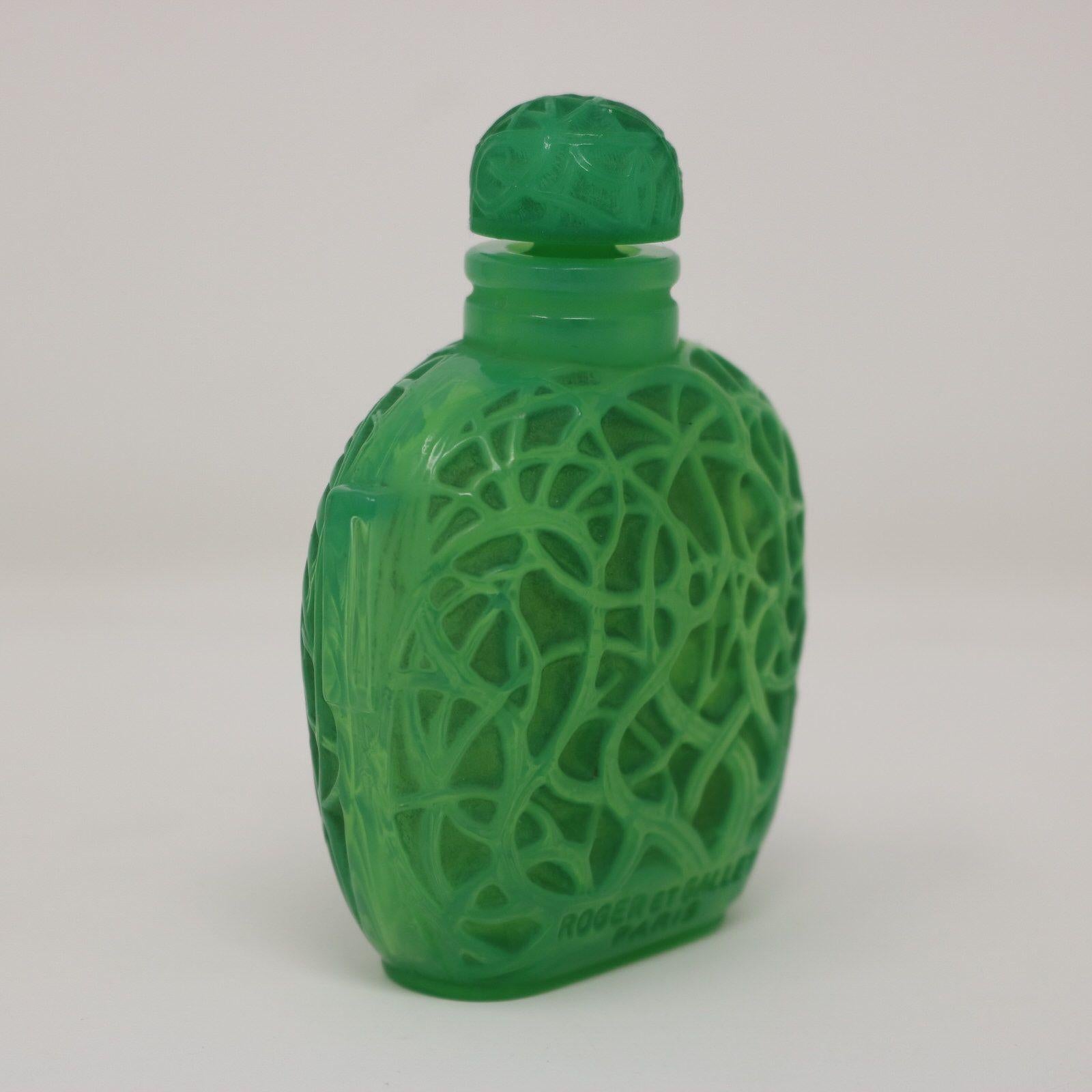 perfume with green cap