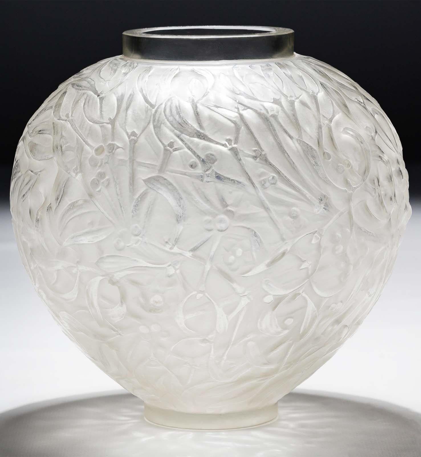 Vintage frosted glass vase by René Lalique made in France in the 1920's. 
The 'Gui' vase takes its name from the French word for mistletoe, a plant rich in symbolism and mystique. Lalique's signature organic design language comes to life as entwined