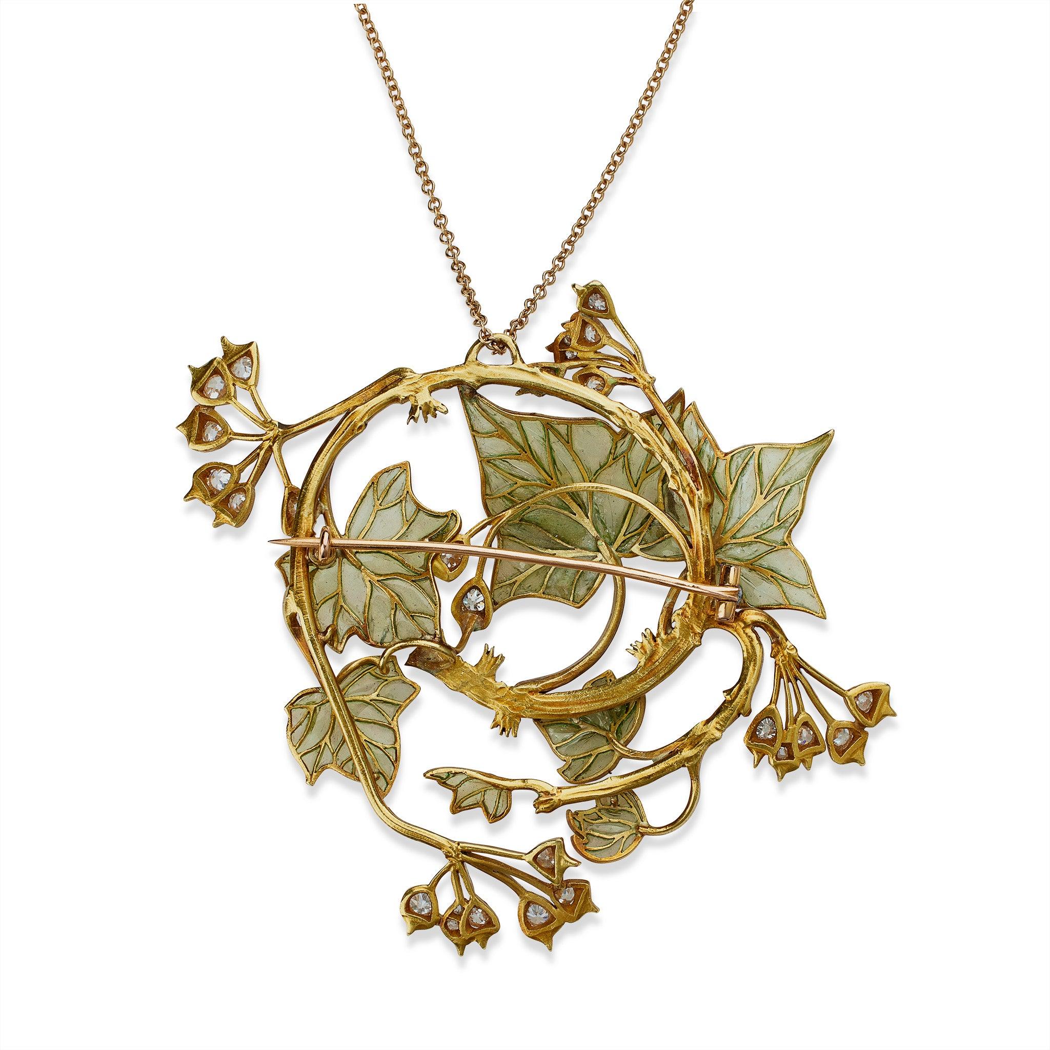 A work of René Lalique dating from circa 1900-1902, this ivy pendant is composed of enamel, diamonds and 18K gold. It is designed as a large and convex open form of circling vines with variegated green, brown, and blue basse taille enamel bearing