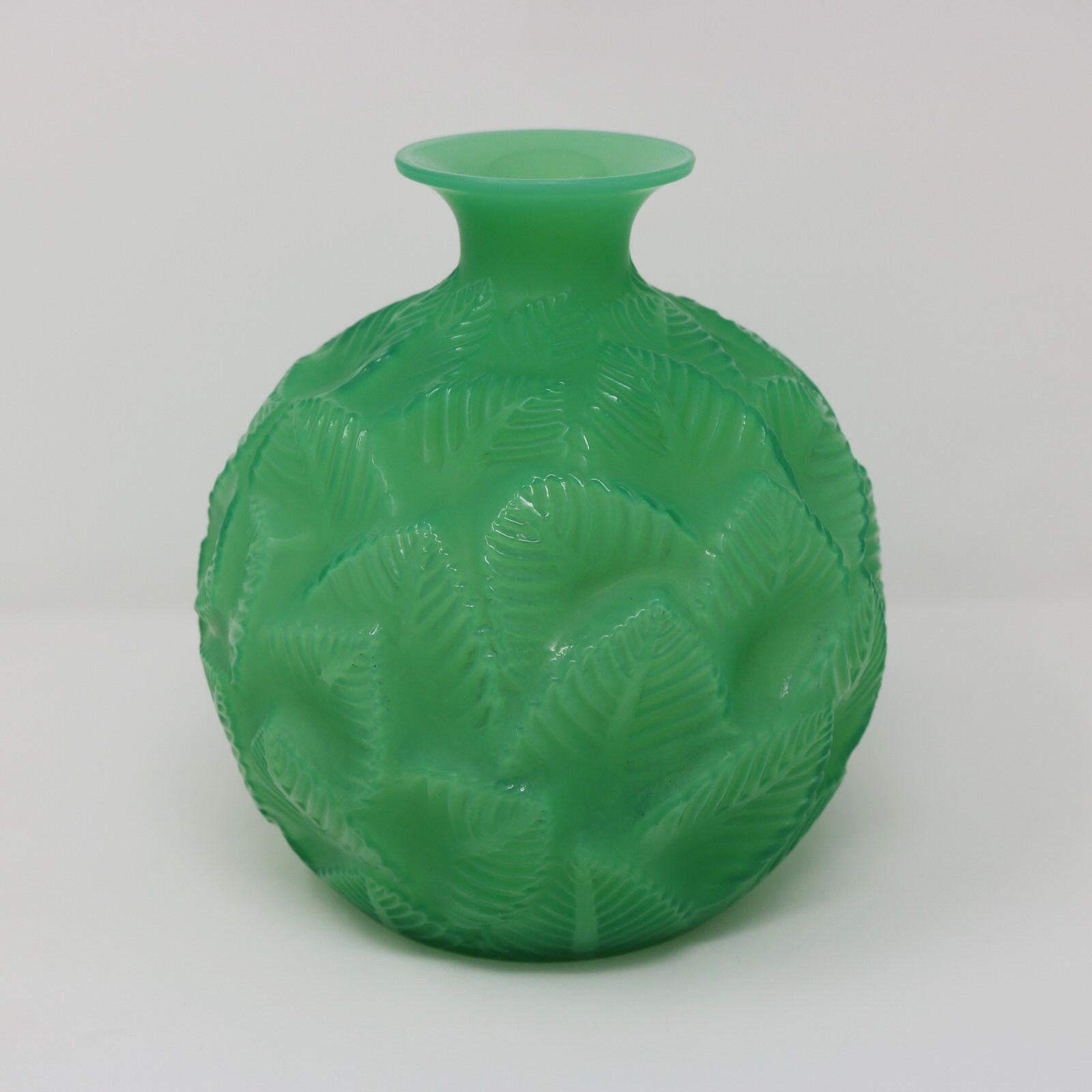 Rene Lalique jade green glass 'Ormeaux' Vase. This pattern features overlapping leaves. Engraved makers mark, 'R Lalique France No. 984'. Book reference: 'R. LALIQUE Catalogue Raisonné De L'Oeuvre De Verre', by Felix Marcilhac. Les Editions De