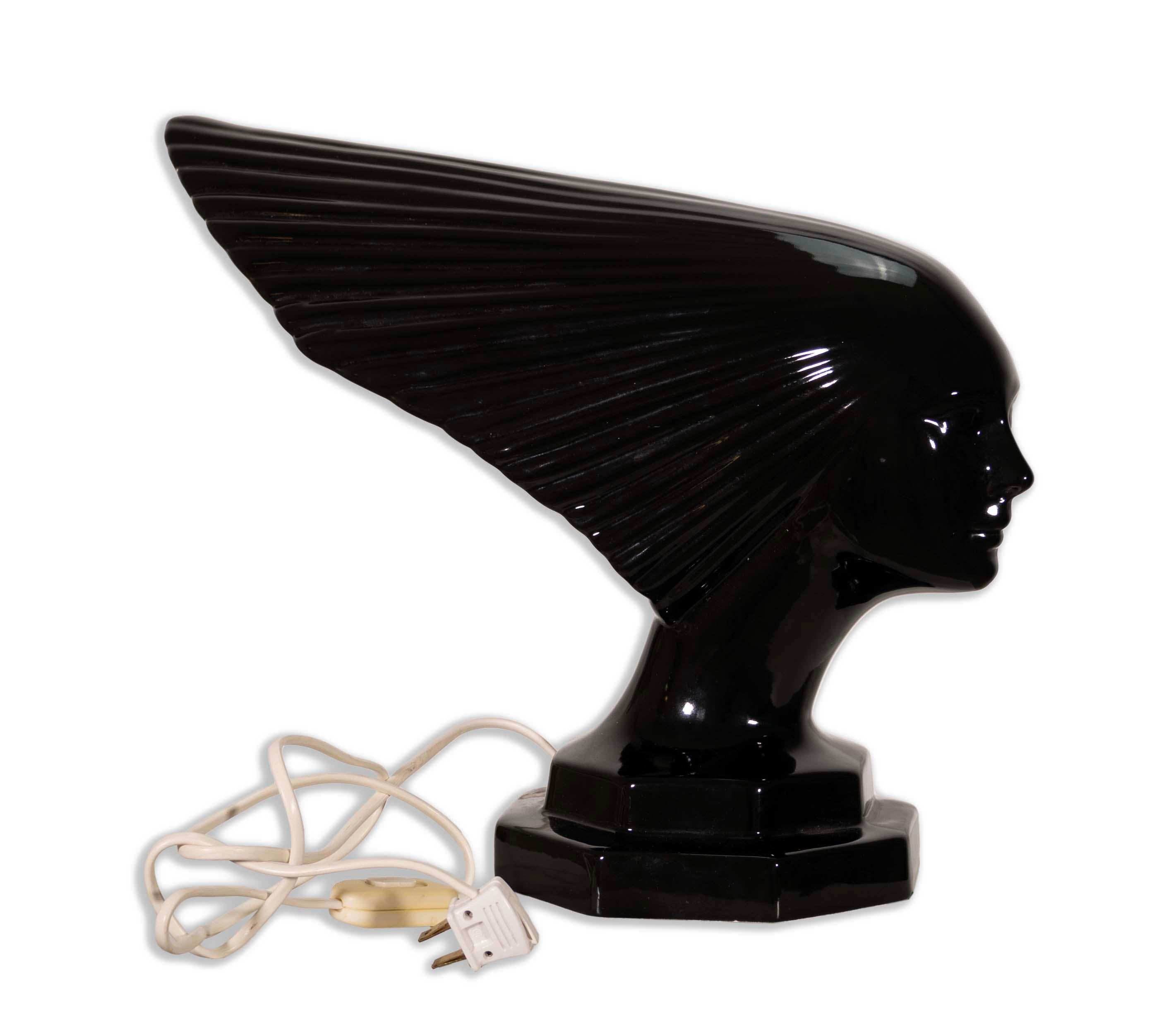 A Rene Lalique Lady Victory Art Deco Female Figural Sculptural Acrylic Lamp. Not only is this a table lamp, it also acts as a piece of art. Depicting 
